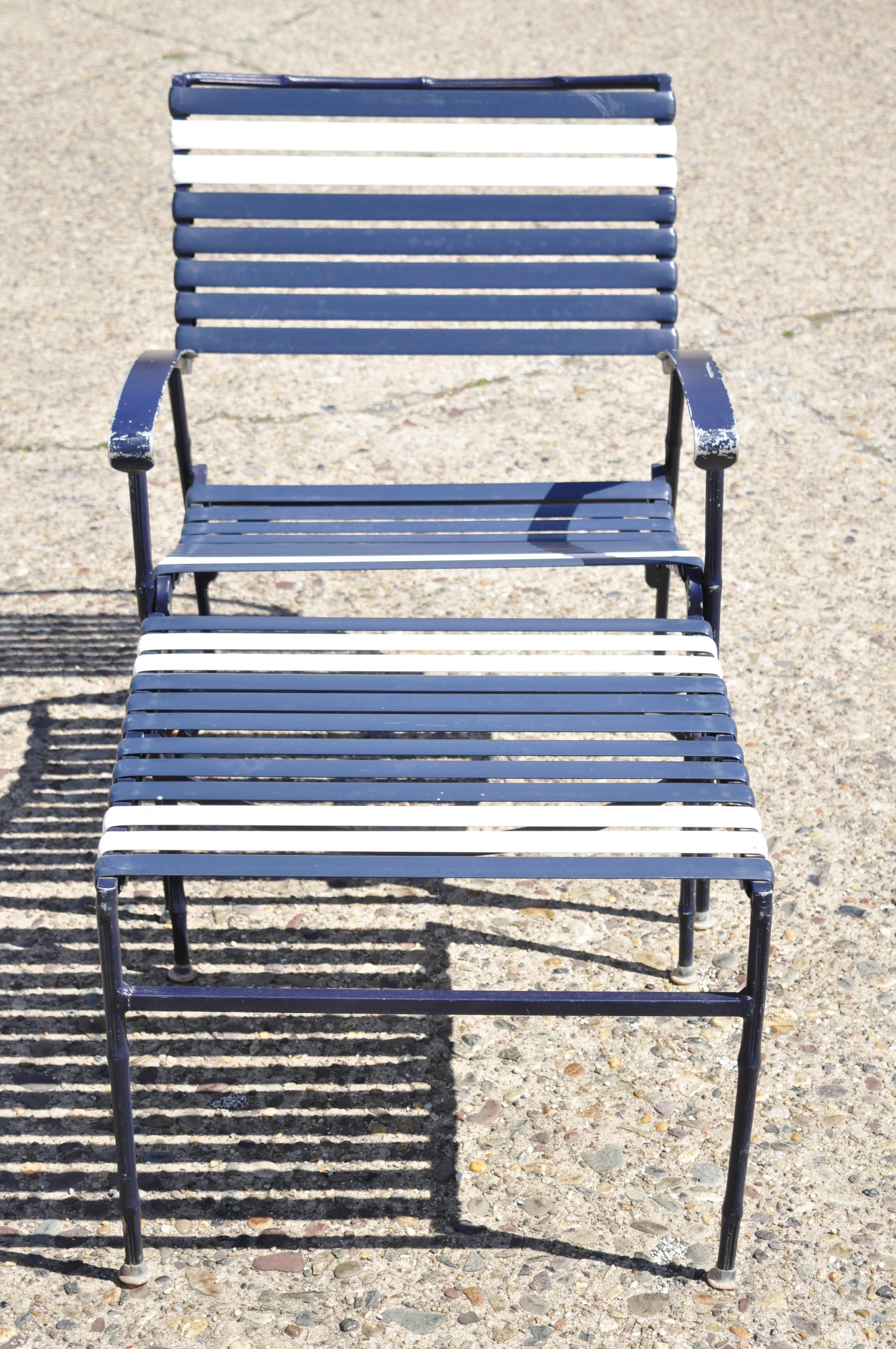 Vintage faux bamboo aluminum vinyl straps blue garden patio lounge chair and ottoman. Item features cast aluminum frames, blue and white vinyl straps, metal armrest, faux bamboo fretwork design, more pieces available in separate listings. Circa mid