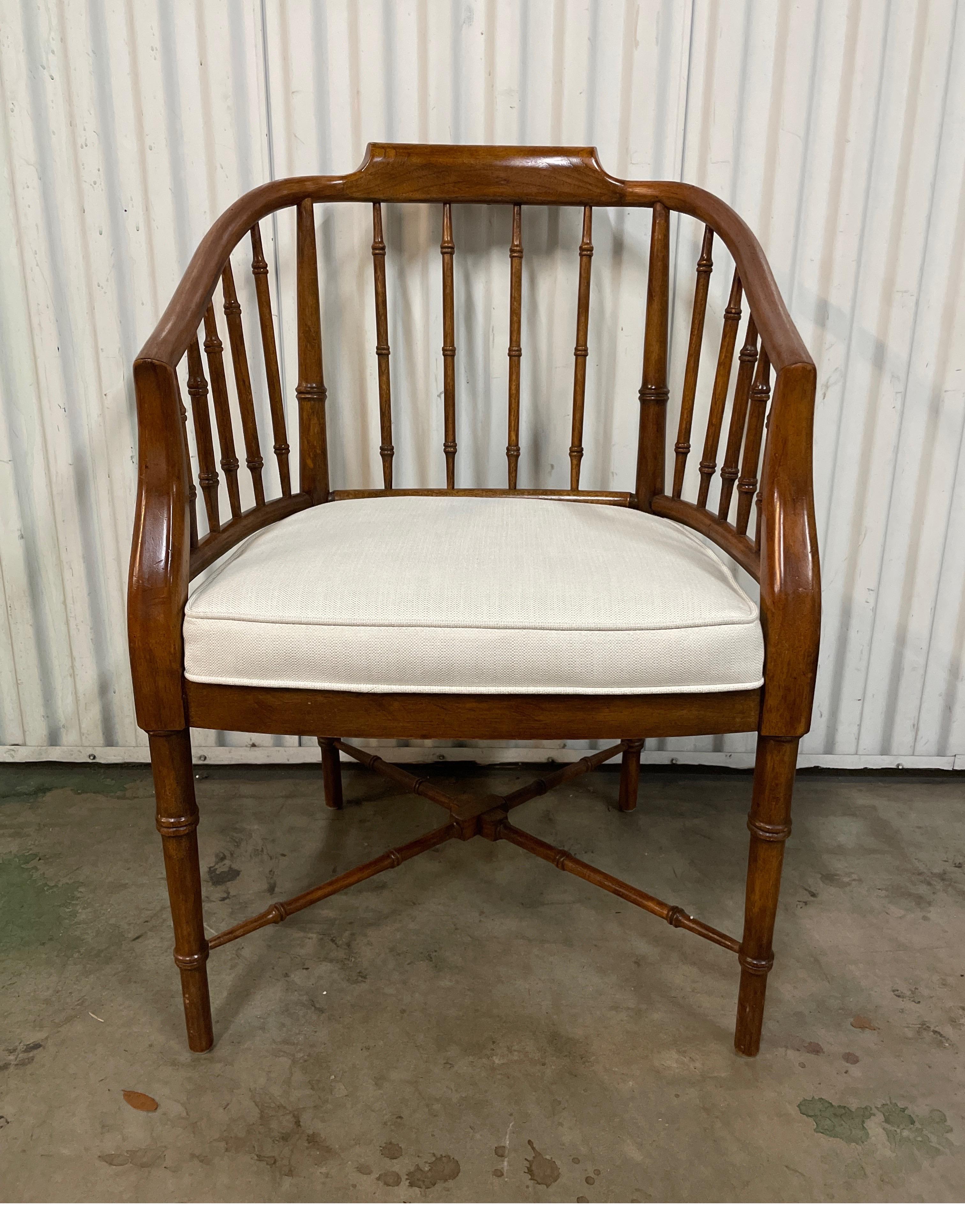 Vintage faux bamboo armchair with newly upholstered seat cushion.