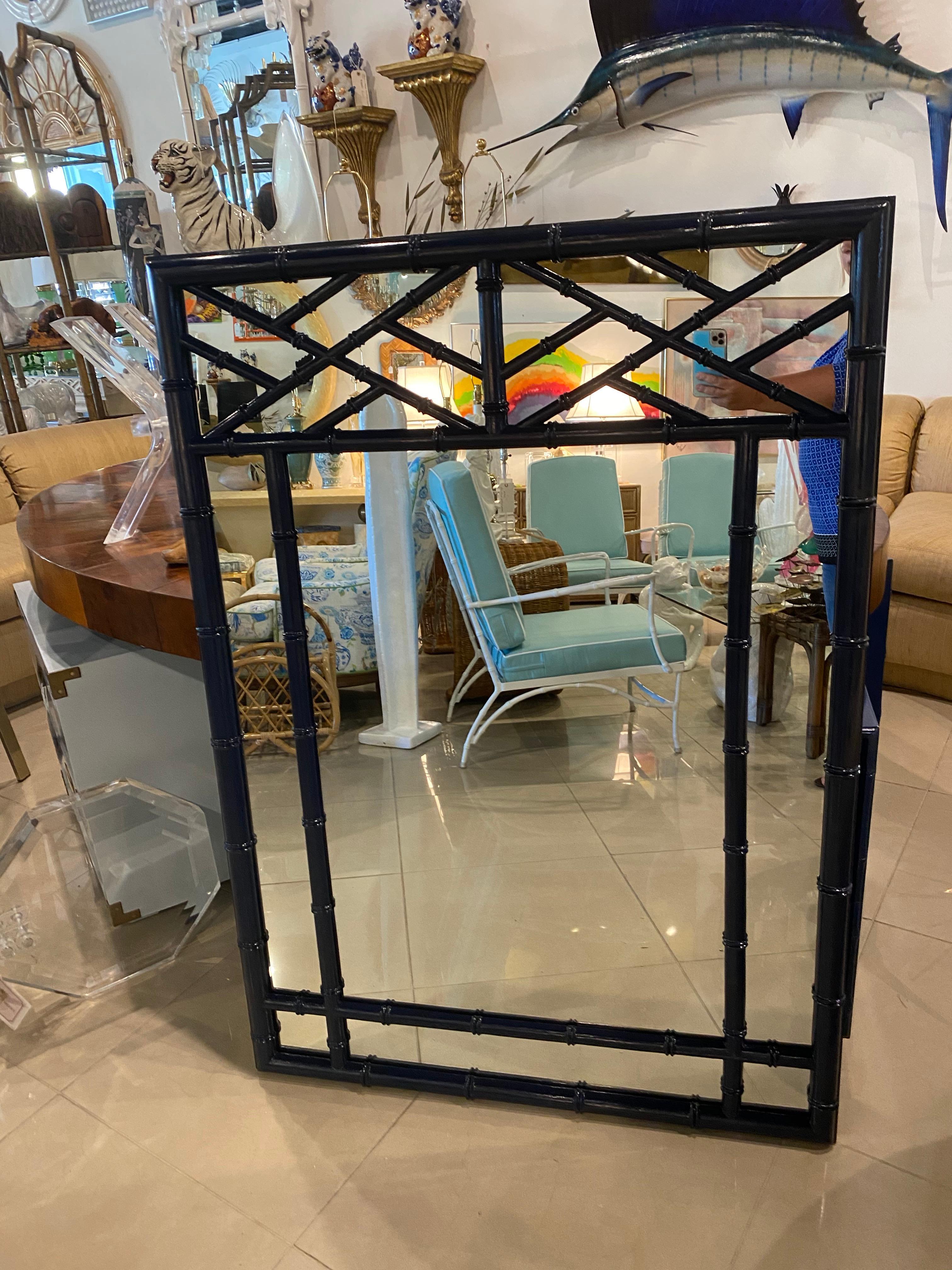 Vintage faux bamboo wall mirror finished in a navy blue gloss. Comes ready to hang on your wall.