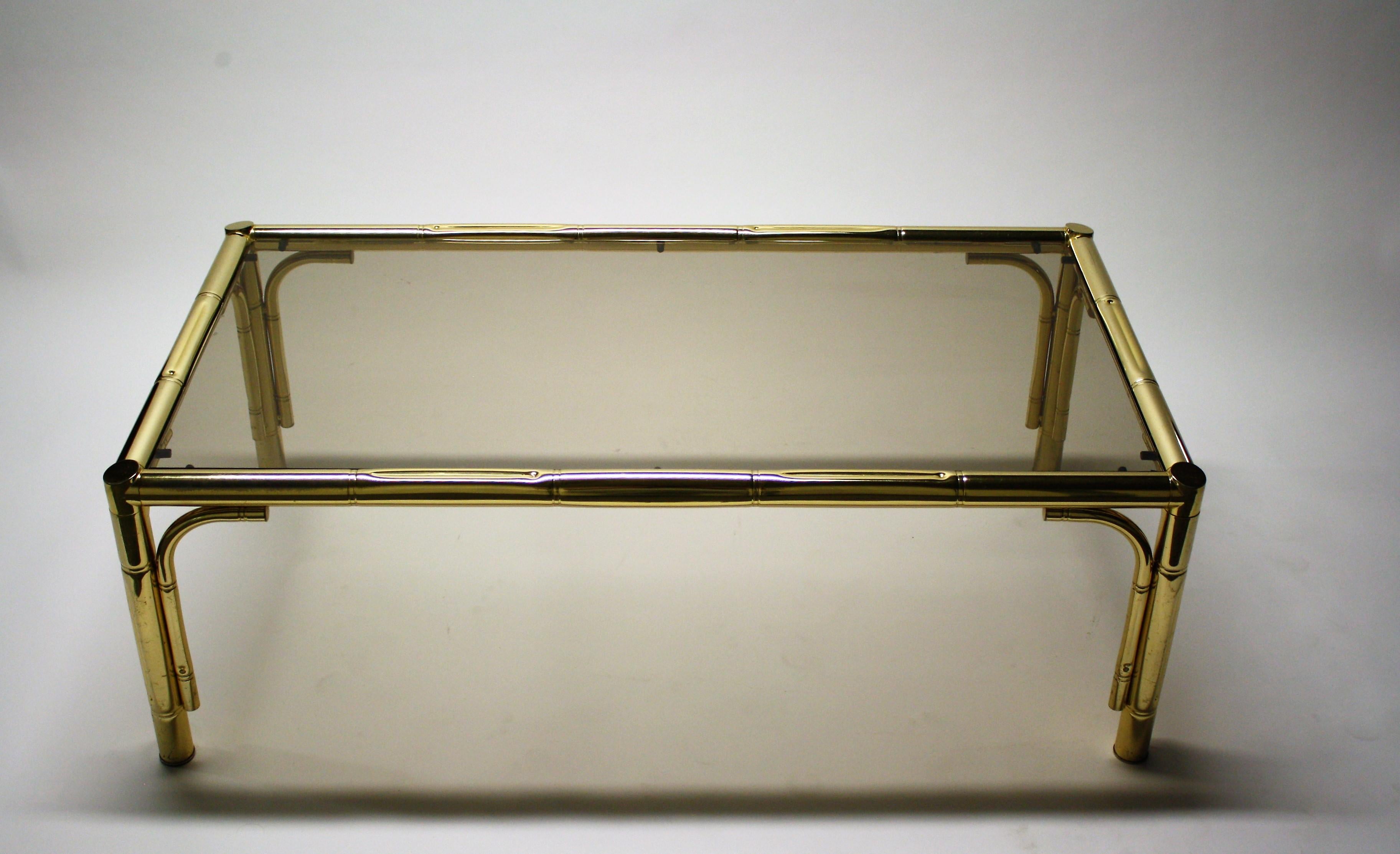 Vintage faux bamboo coffee table with smoked glass.

Good condition will be supplied with a new smoked glass top.

France, 1970s.

Measures: Height 40cm/15.8