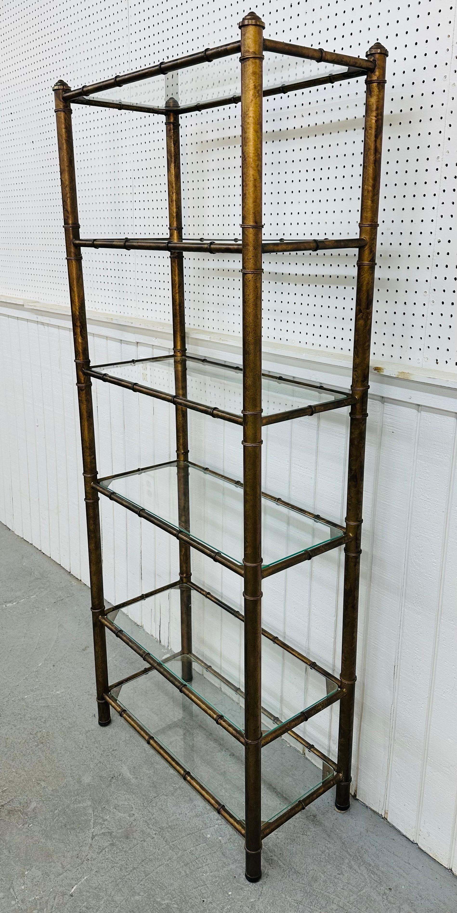 This listing is for a vintage Faux Bamboo Glass Etagere. Featuring a boho chic faux bamboo design, six glass shelves for storage, and a beautiful antique brass finish. This is an exceptional combination of quality and design!