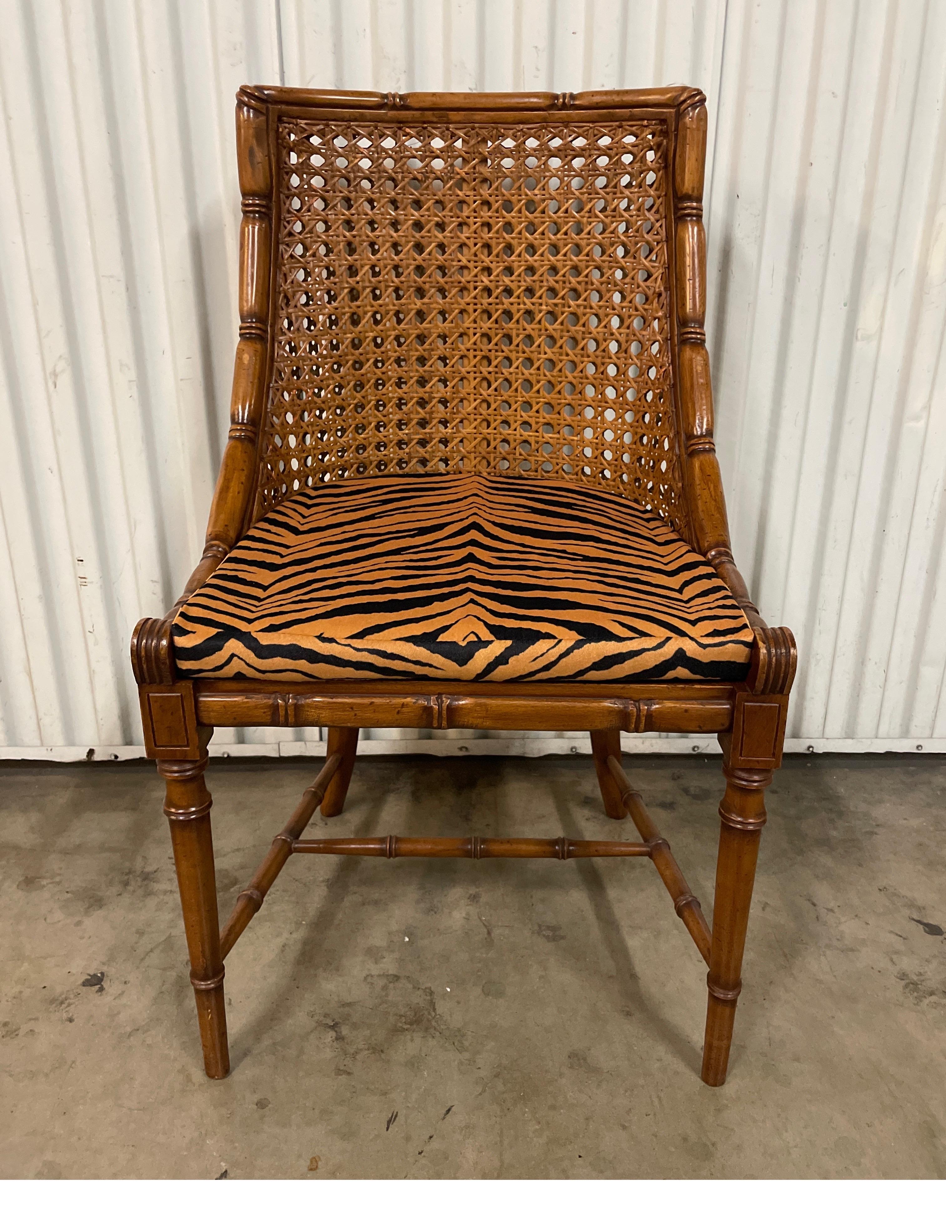Vintage Italian Klismos style faux bamboo double caned back side chair with animal print loose cushion.