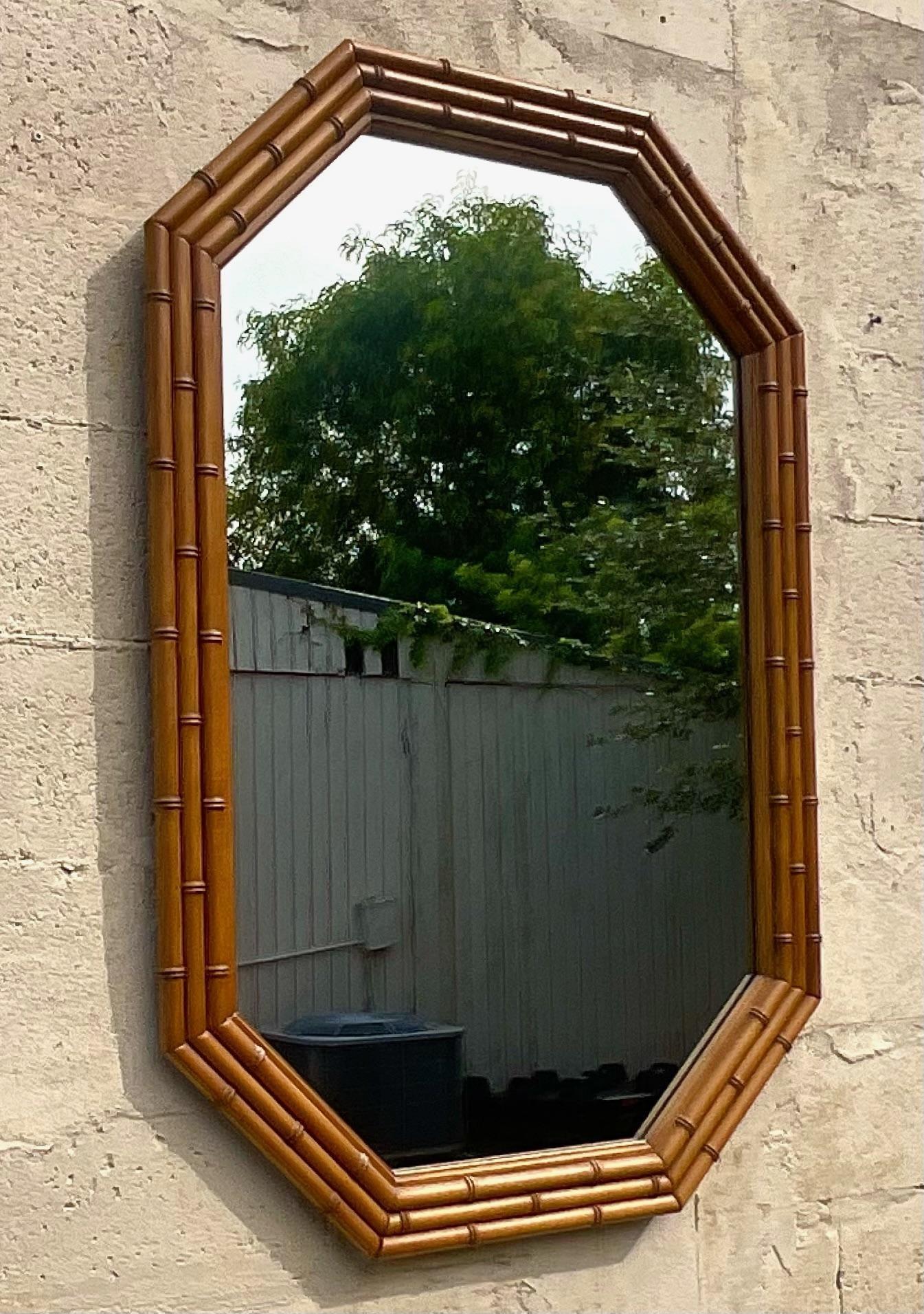 Intricate heavy three layer faux bamboo octagonal wall mirror. This is one of the best we have come across of a mirror so often duplicated, but this is an original. Acquired from a Palm Beach estate.