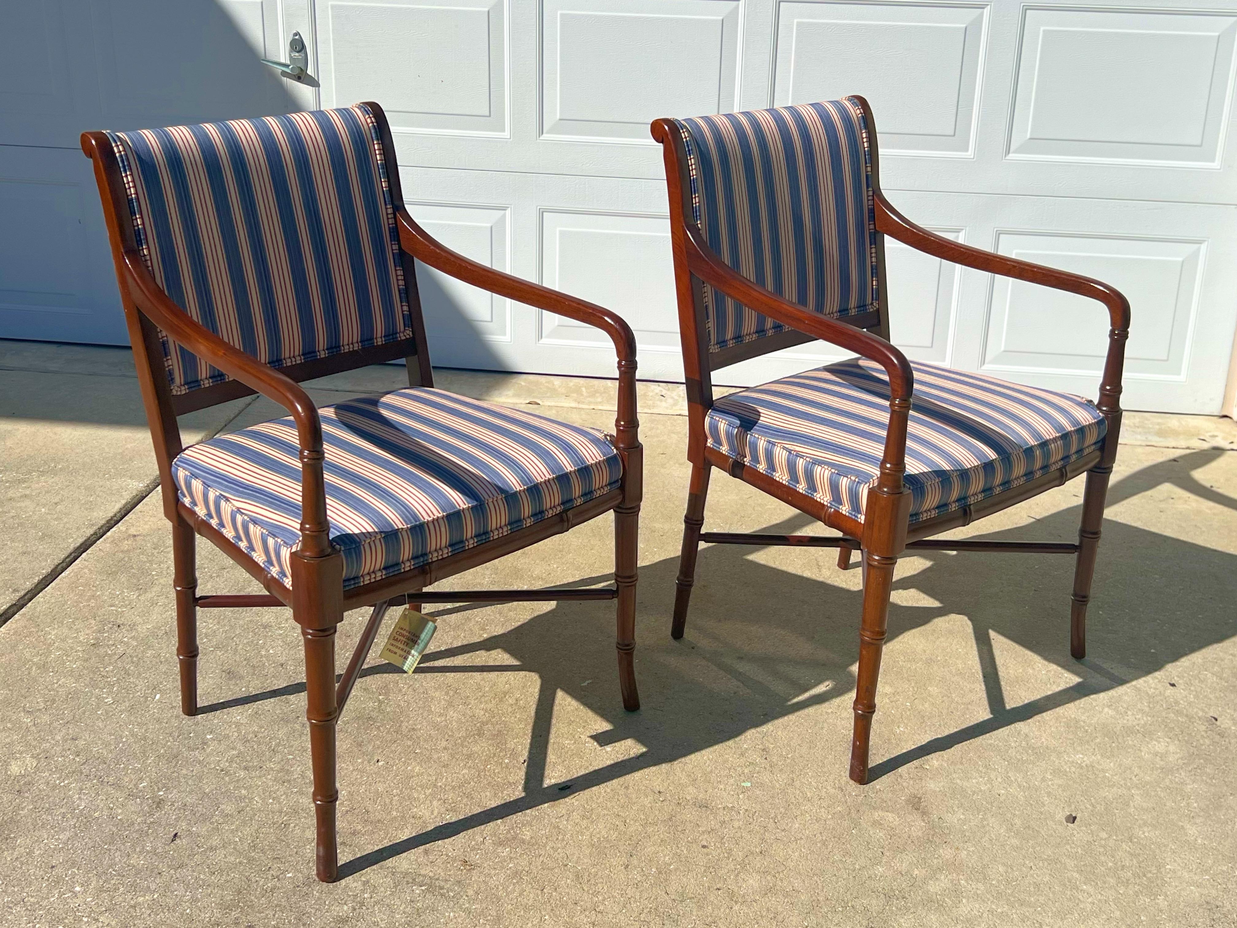 Finely crafted mahogany Regency style armchairs with scrolled crest rail ends and ring turned arm supports and legs. With H stretchers. Upholstered in a lovely fine blue and cream and red tiny striped fabric, very clean.  The fabric is in pristine