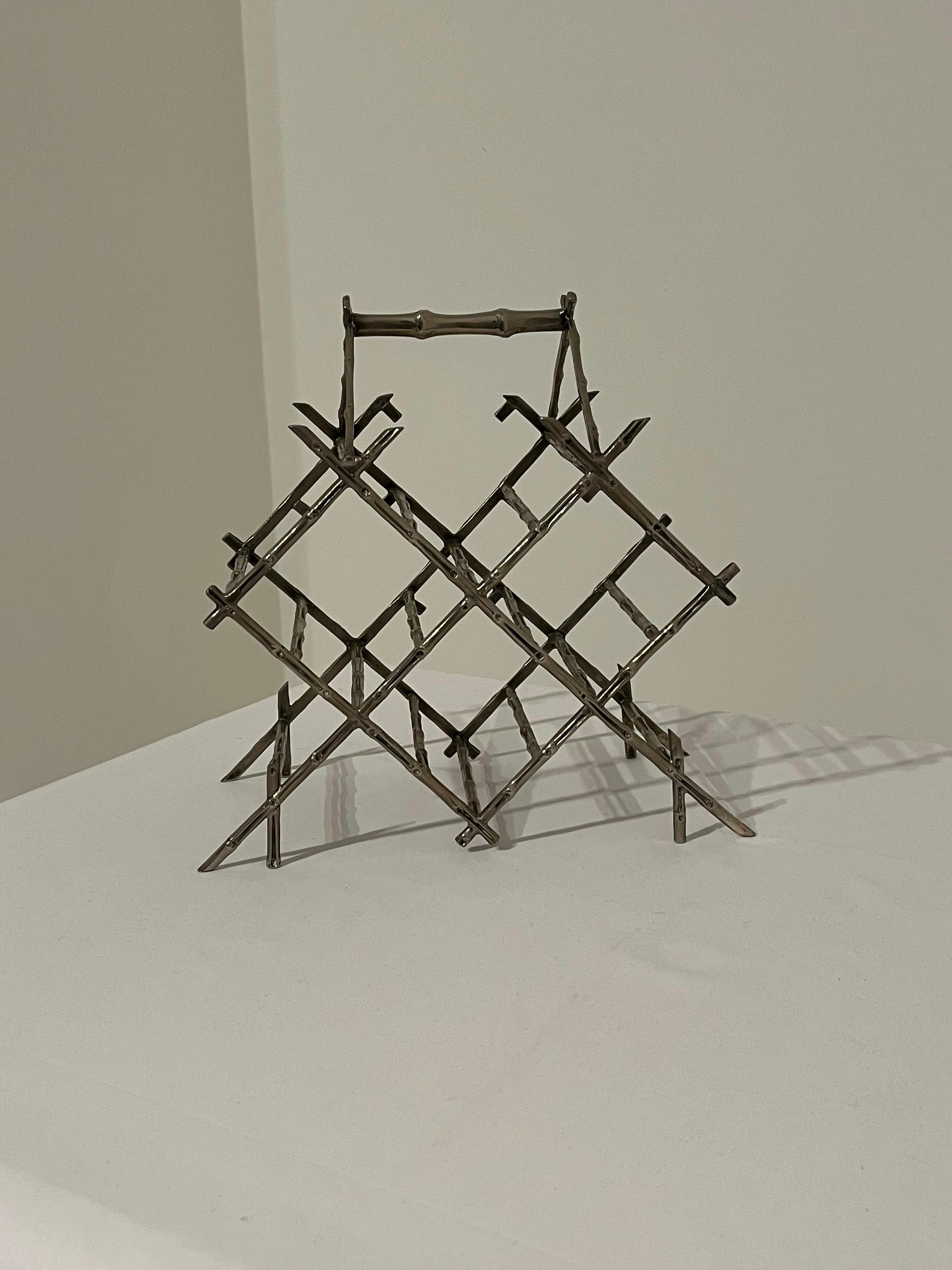 Beautiful Faux bamboo wine rack in nickel. 

Holds four 8cm width bottles 