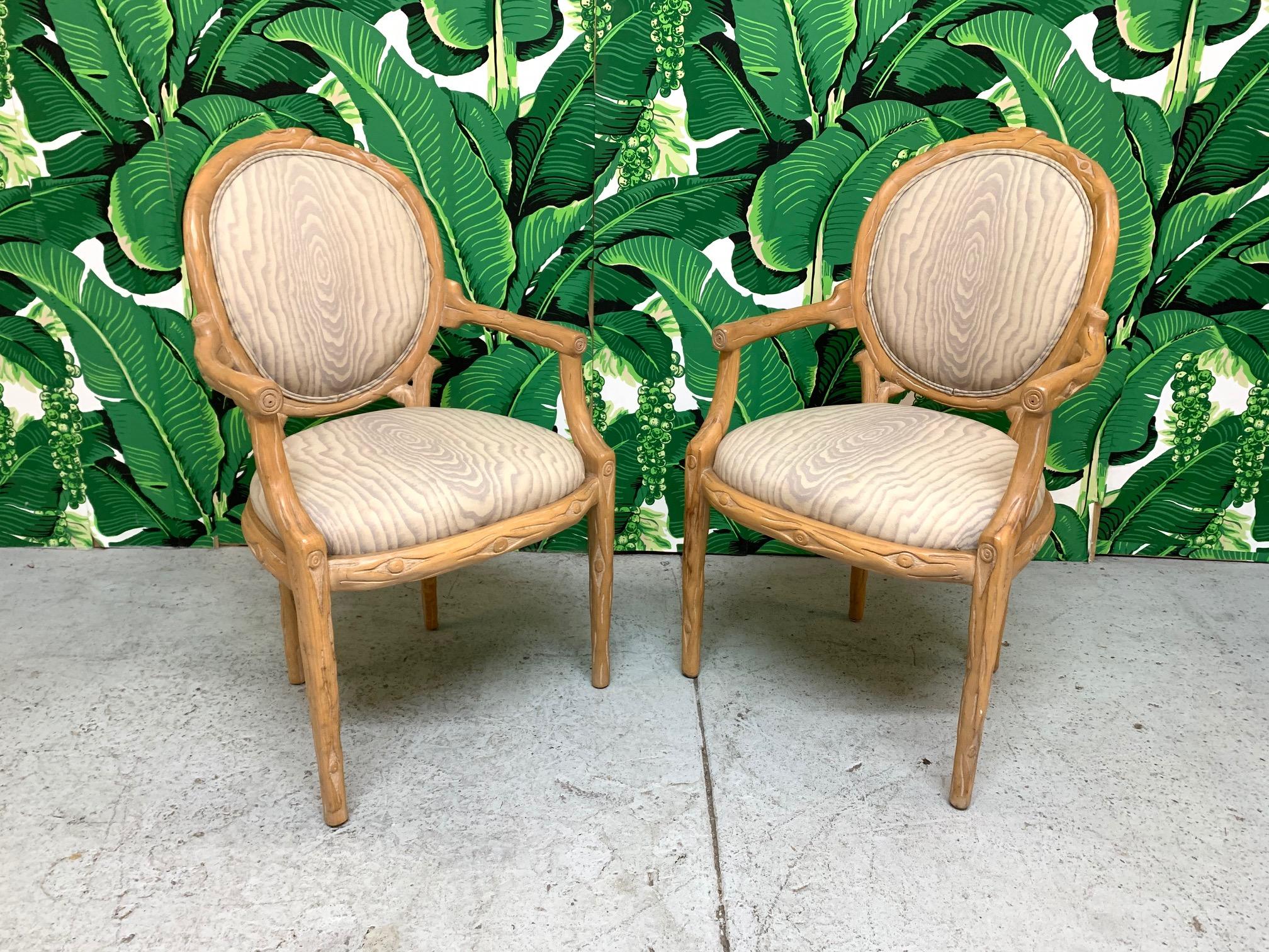 Set of 2 vintage faux bois carved dining chairs in excellent condition. Upholstery also in excellent condition. Seat height is 19.5