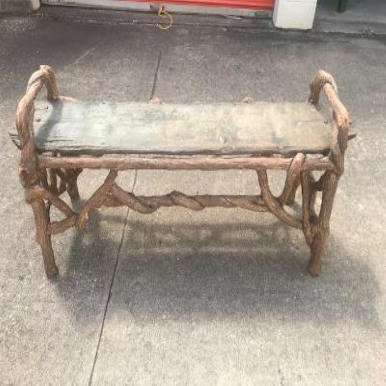 Fantastic organic modern faux bois garden bench. Our charming faux bois bench has beautiful twisted vine detail and an unusual slab top.
This rustic bench is beautifully weathered and will make a statement in your garden, on your patio or in a