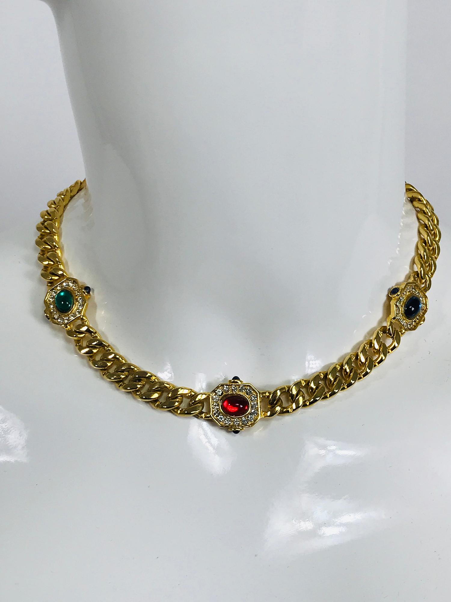 Vintage faux jewel chunky gold metal choker necklace from the 1990s. Well made costume jewel necklace with three cabochon of faux sapphire, emerald and ruby with crystal rhinestones. In very good vintage condition Necklace closes at the back with a