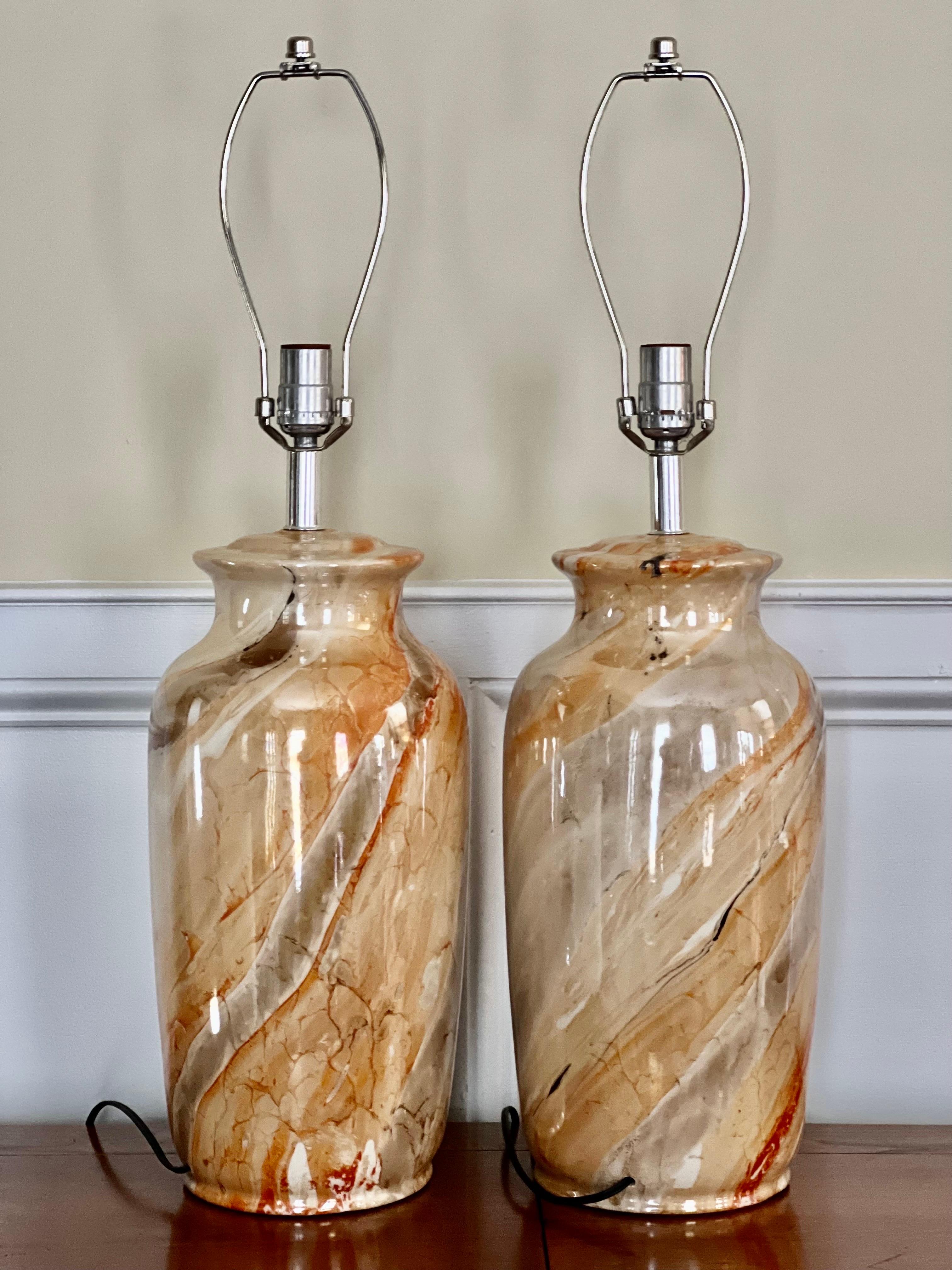 Beautiful pair of vintage faux marbleized glazed ceramic table lamps.

The finish is a lustrous high gloss glaze in neutral, muted earth tones of gray, cream, tan and auburn with a touch of  black.  The marble design is gorgeous and the pair is in