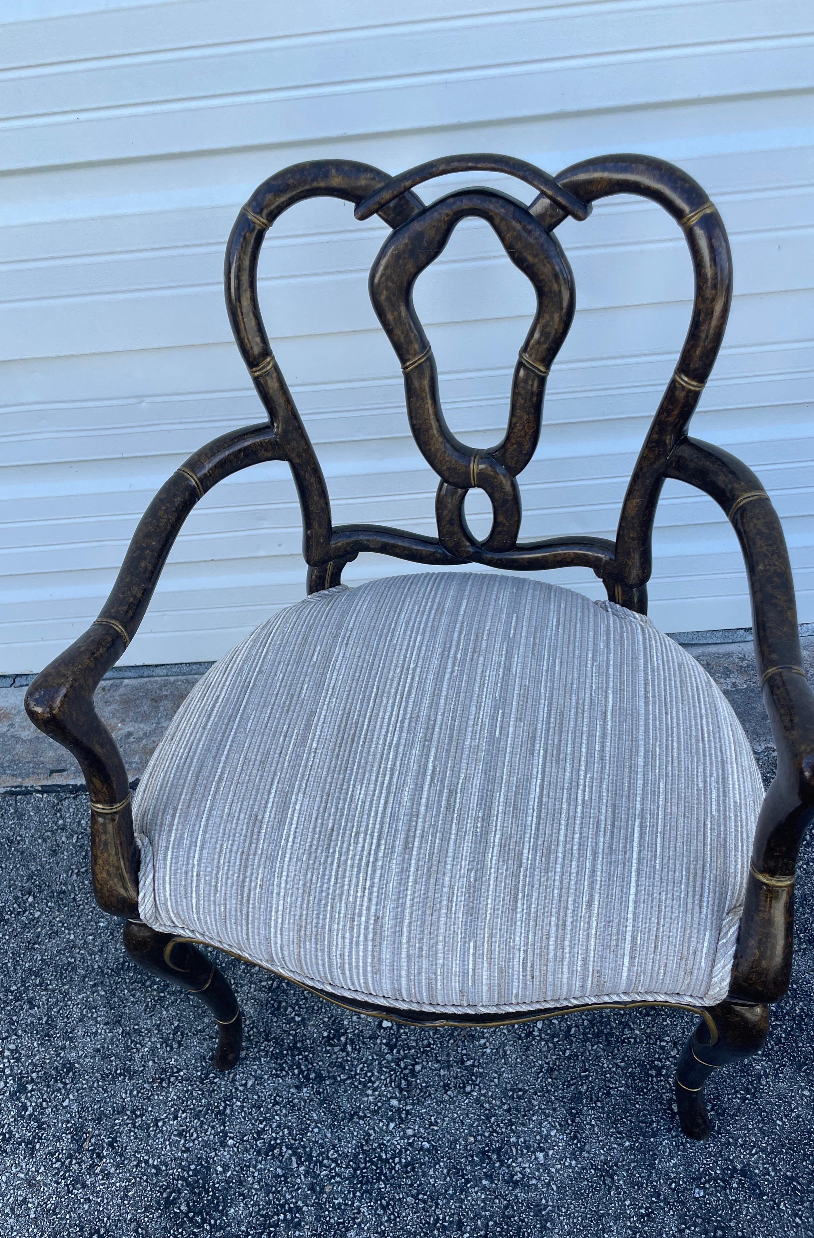 Vintage Faux painted tortoise pretzel back armchair with newly upholstered seat cushion.