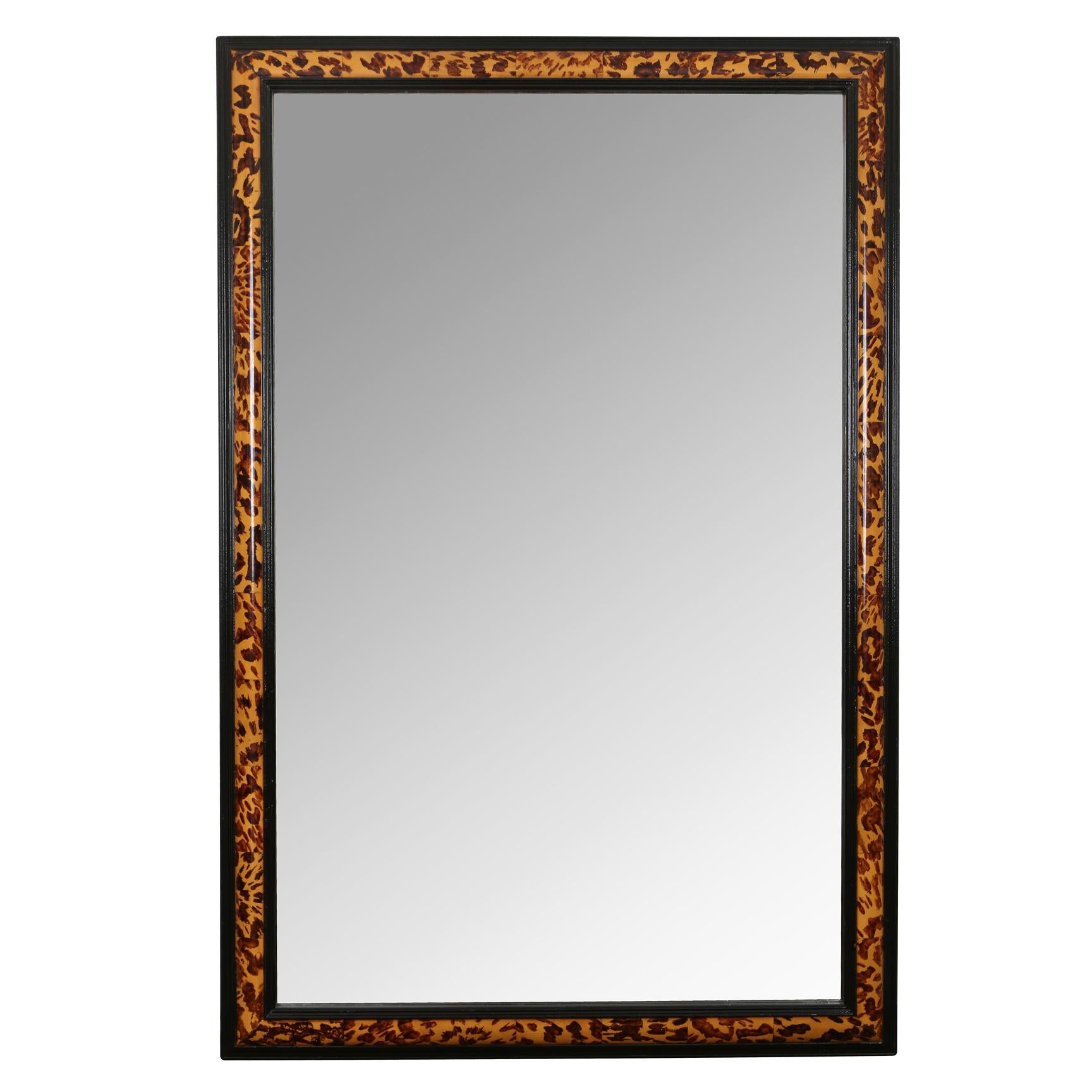 A super chic vintage mirror with faux painted tortoise shell frame.