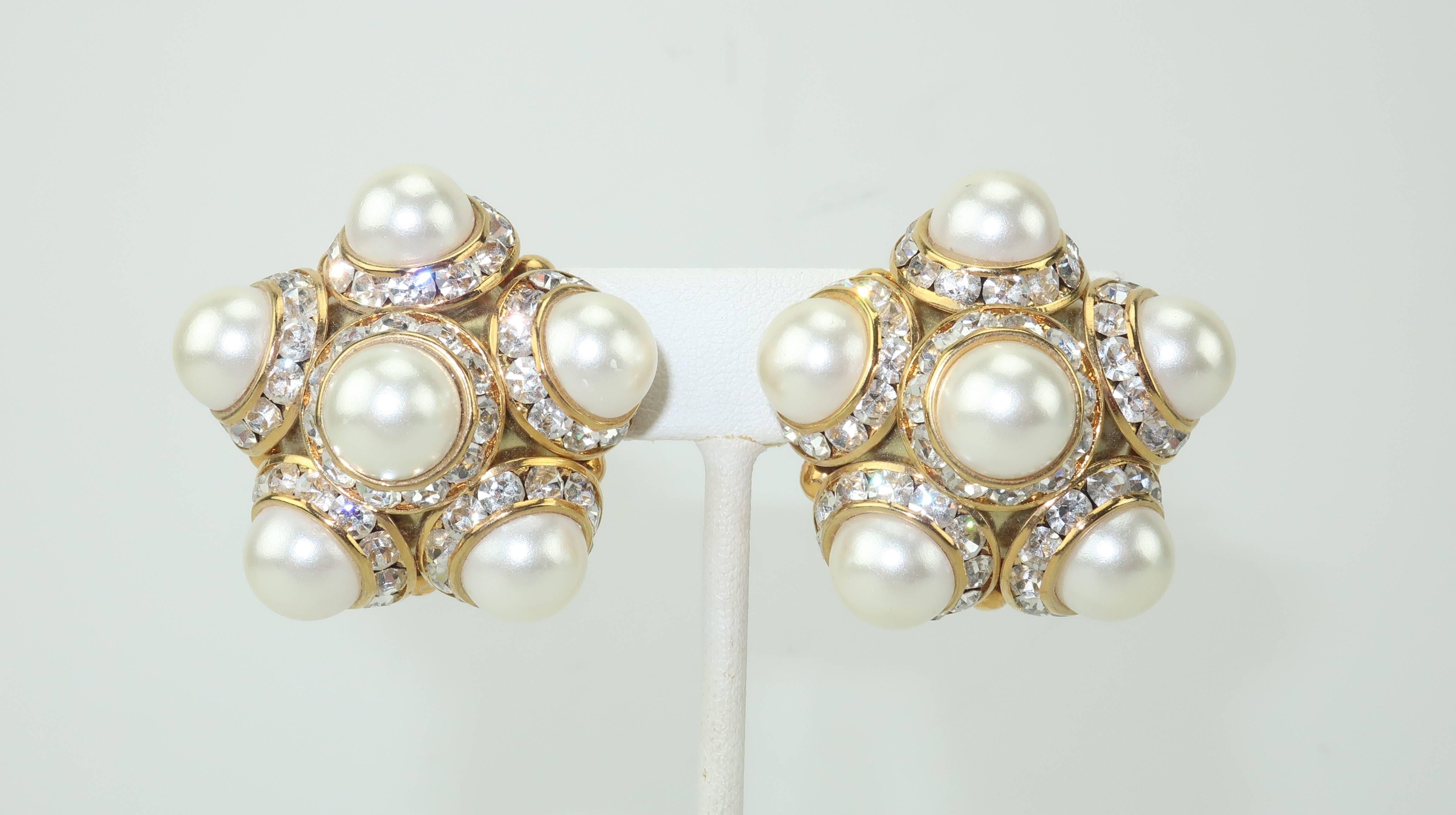 Get a glamorous Chanel look without the money!  These classically beautiful clip on earrings are a gold tone metal embellished with pearls framed by sparkly crystal rhinestones.  Though unsigned, they are well made and have a stylish