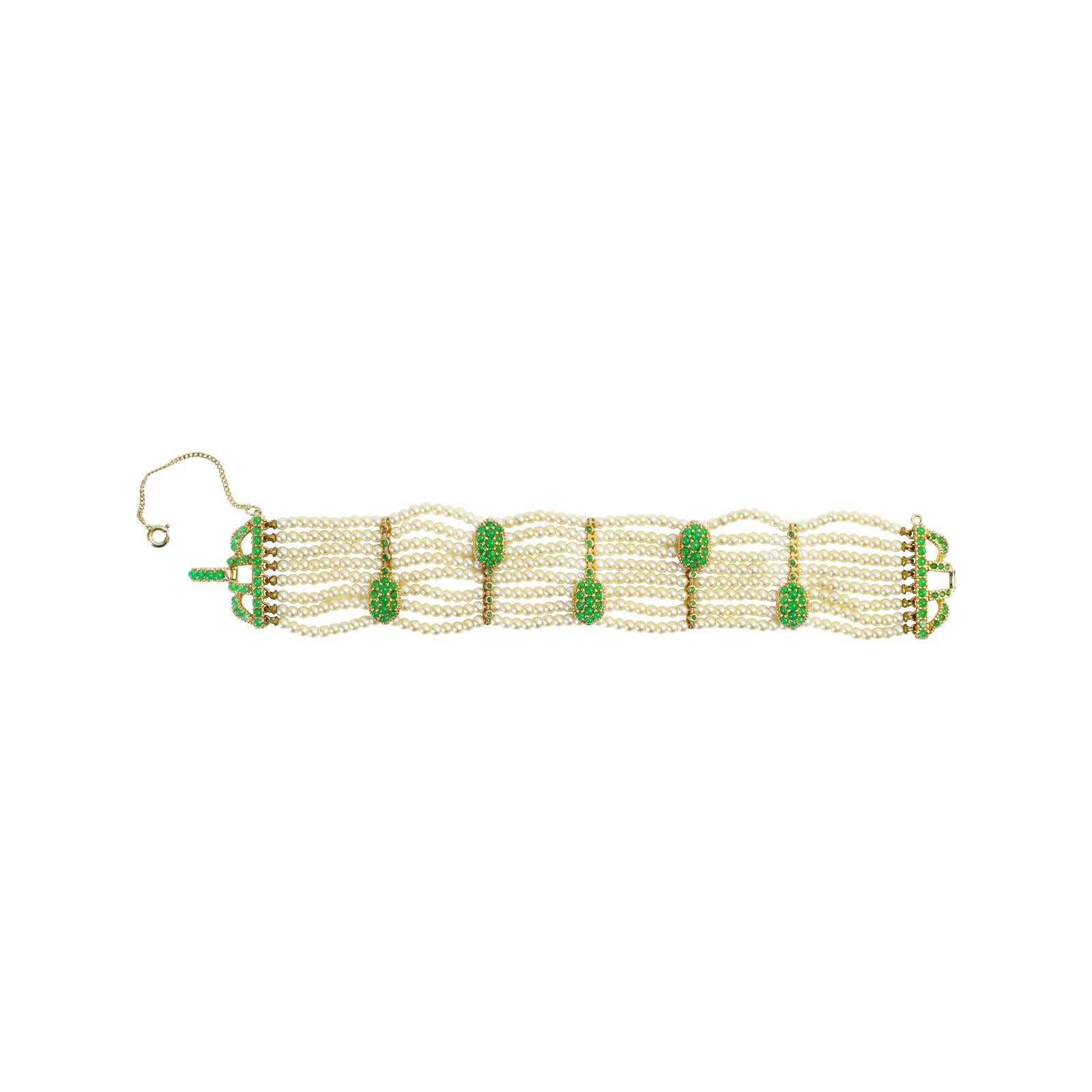 Vintage Faux Pearl With Gold and Green Bead Accent  Bracelet Circa 1980s. This is a beautifully crafted bracelet, and the pearls are in perfect condition. There are pieces of green sitting on top of gold, which in turn sit on top of the faux pearls.