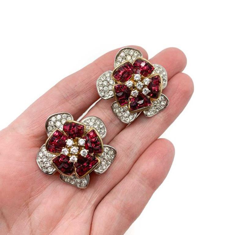 Vintage Ruby Crystal Flower Earrings. Stunning craftsmanship. Created in solid sterling silver and set with 'invisibly set' ruby and white crystals in a captivating floral design. Exceptional quality and attention to detail. Very good condition.