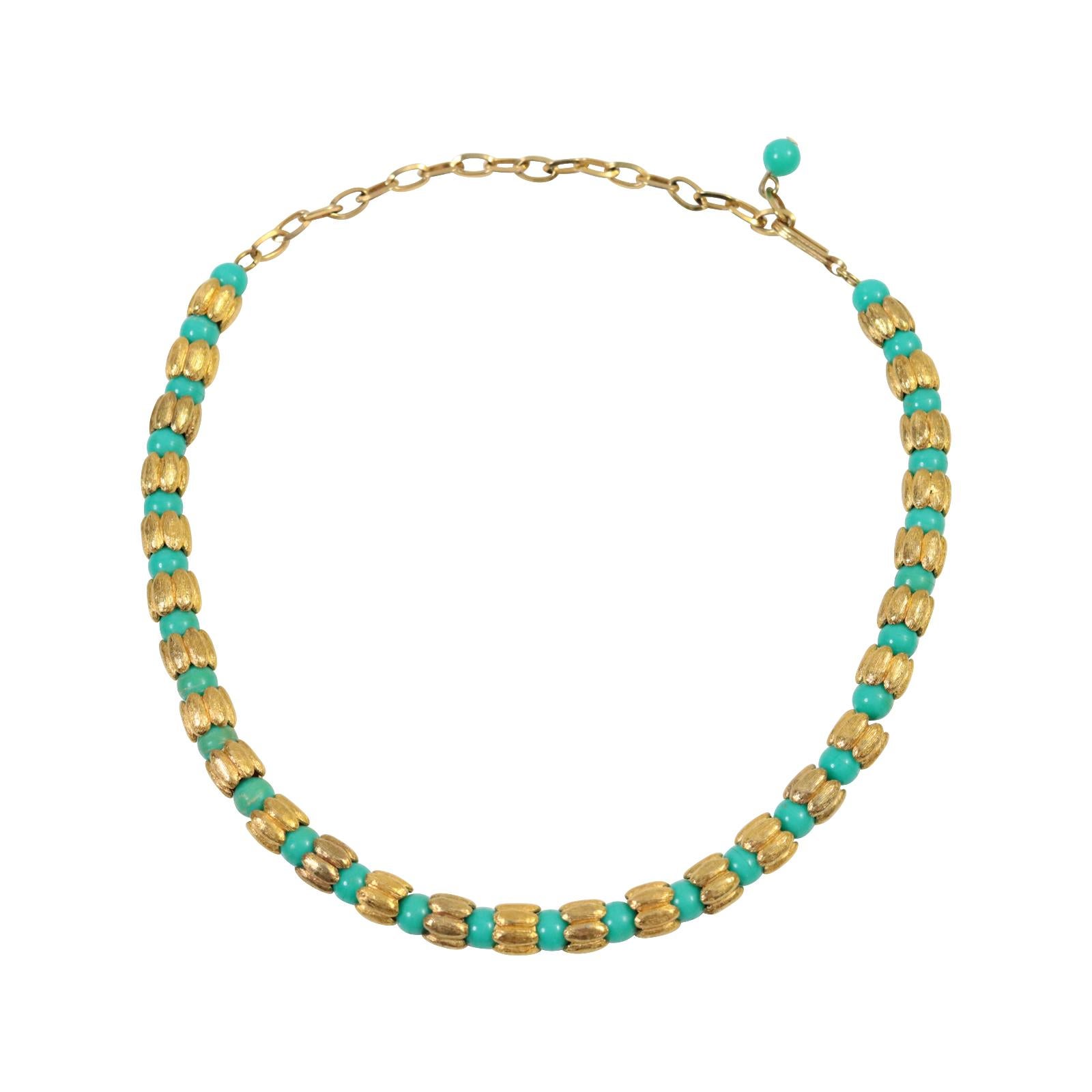 Vintage Faux Turquoise Gold Tone Beaded Choker Gold Tone Beaded Circa 1980s.  This is a tiny and elegant choker.  Not flashy but says its piece.  Something akin to THE ROW.  It's quiet, but it looks great.  It is small, but the gold beads in between