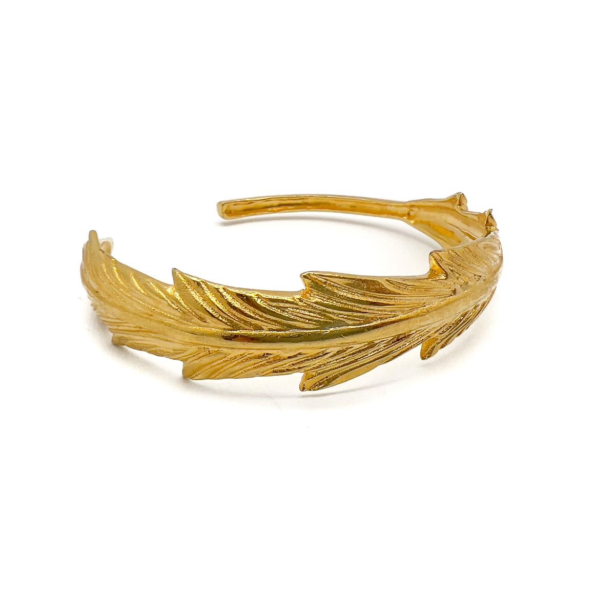 Stylishly simple, this Vintage Feather Torque Cuff will prove a jewel box hero and the perfect gift.

An unsigned beauty. A rare treasure. Just because a jewel doesn’t carry a designer name, doesn’t mean it isn't coveted. The unsigned beauties in