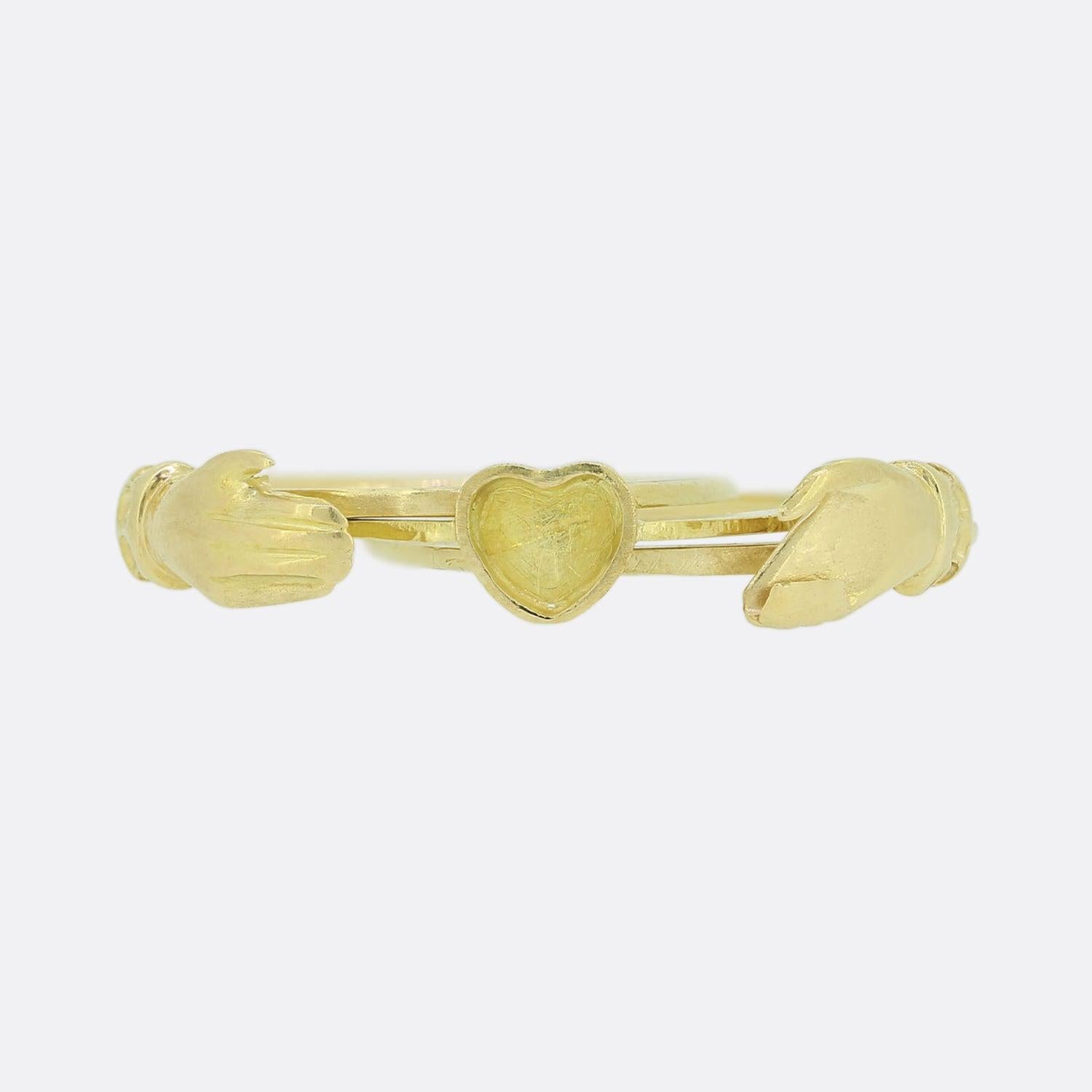 Here we have a vintage fede gimmel ring. The ring is comprised of three separate 18ct yellow gold hoops linked together with the same shank split lengthwise so the hoops fit together unnoticeably as one. Two interlocking hands pull apart to reveal a