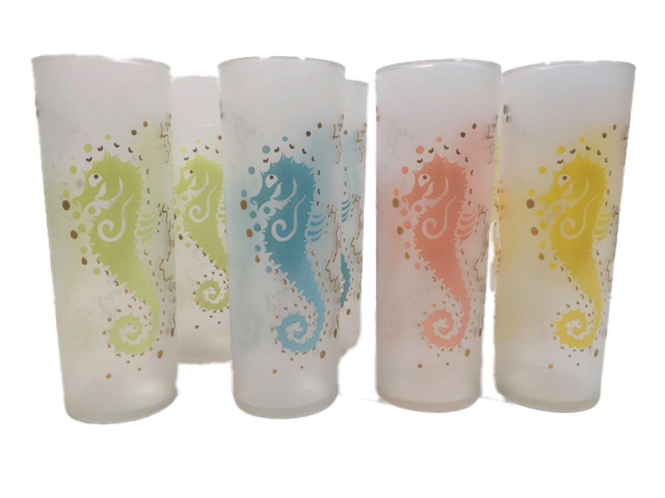 Set of 8 vintage Tom Collins glasses by Federal Glass. Each glass with a seahorse in colored enamel with gold details on a frosted ground. The set of 8 made up of two each of four colors, blue, green, yellow and pink.