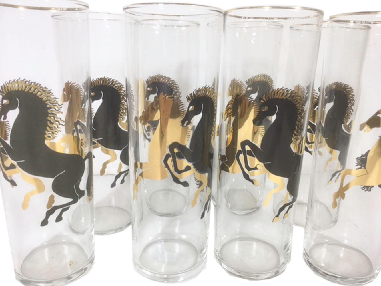 Eight vintage Tom Collins glasses with a pair of rearing stallions shadowing each other one in 22k gold the other in black enamel with gold details.