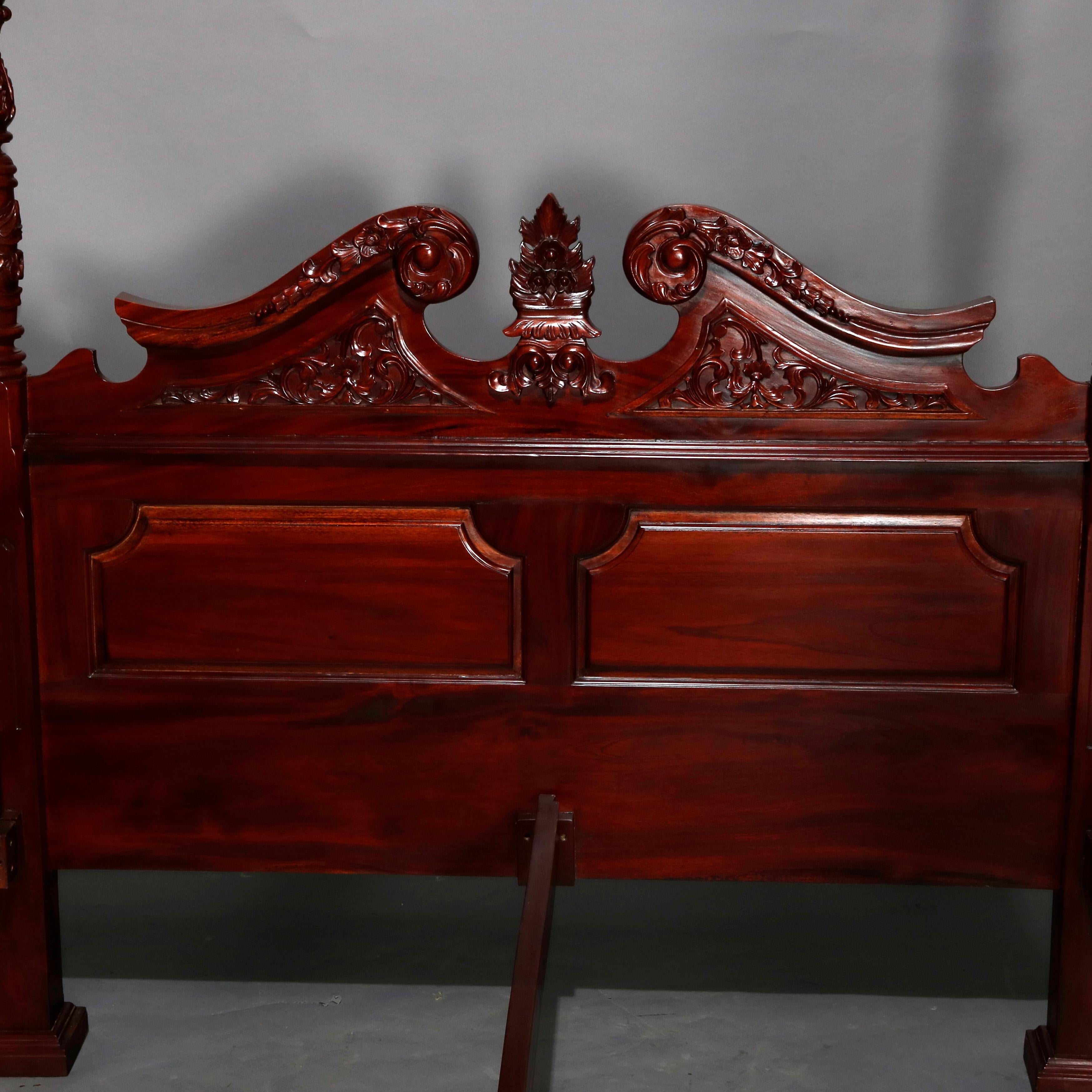 A vintage Federal style queen size tester bed offers deeply striated mahogany construction with broken arch paneled headboard having carved foliate and scroll decoration, rope twist posts with heavily carved acanthus elements and stylized flame