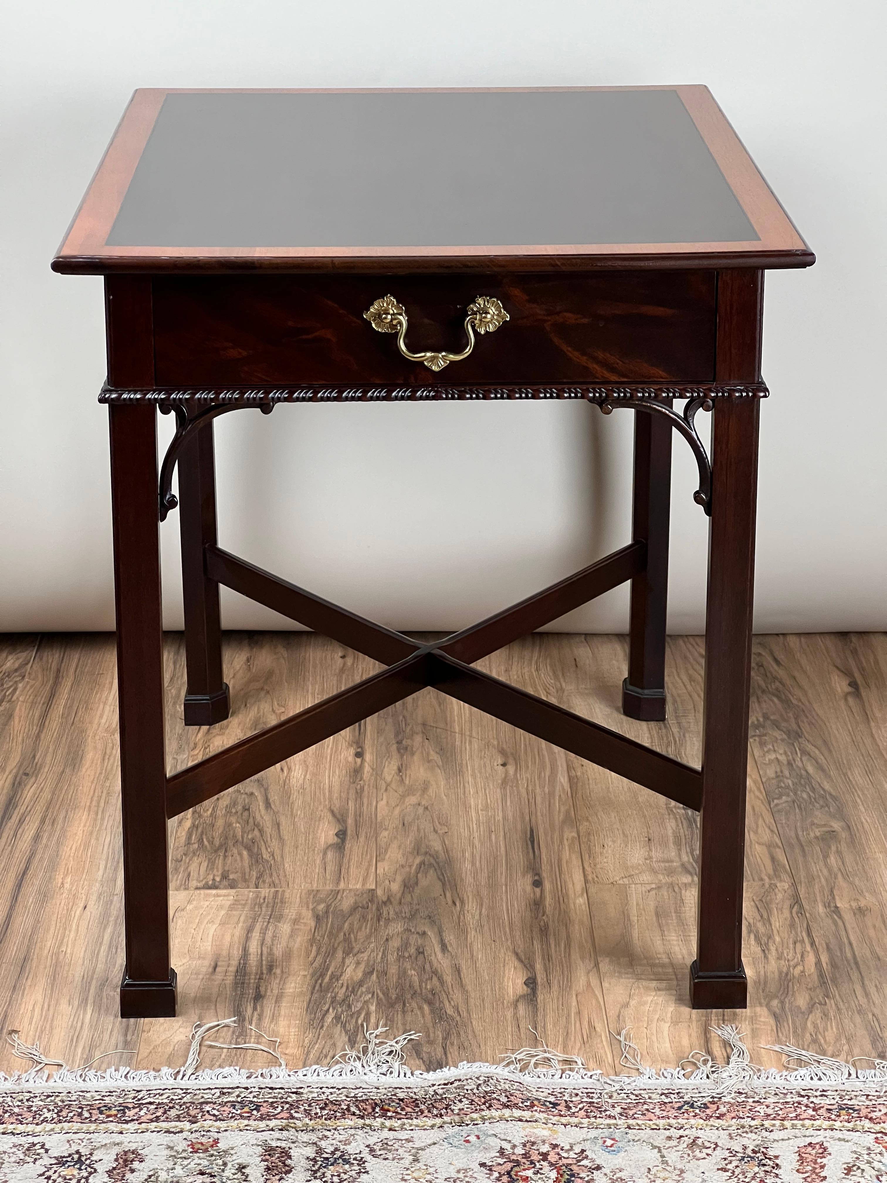A beautifully crafted vintage Federal style one-drawer end table by Stickley, featuring a cross-stretcher base and elegant pierced corner brackets. The table is made from richly grained mahogany and finished in a warm, hand-rubbed polish that