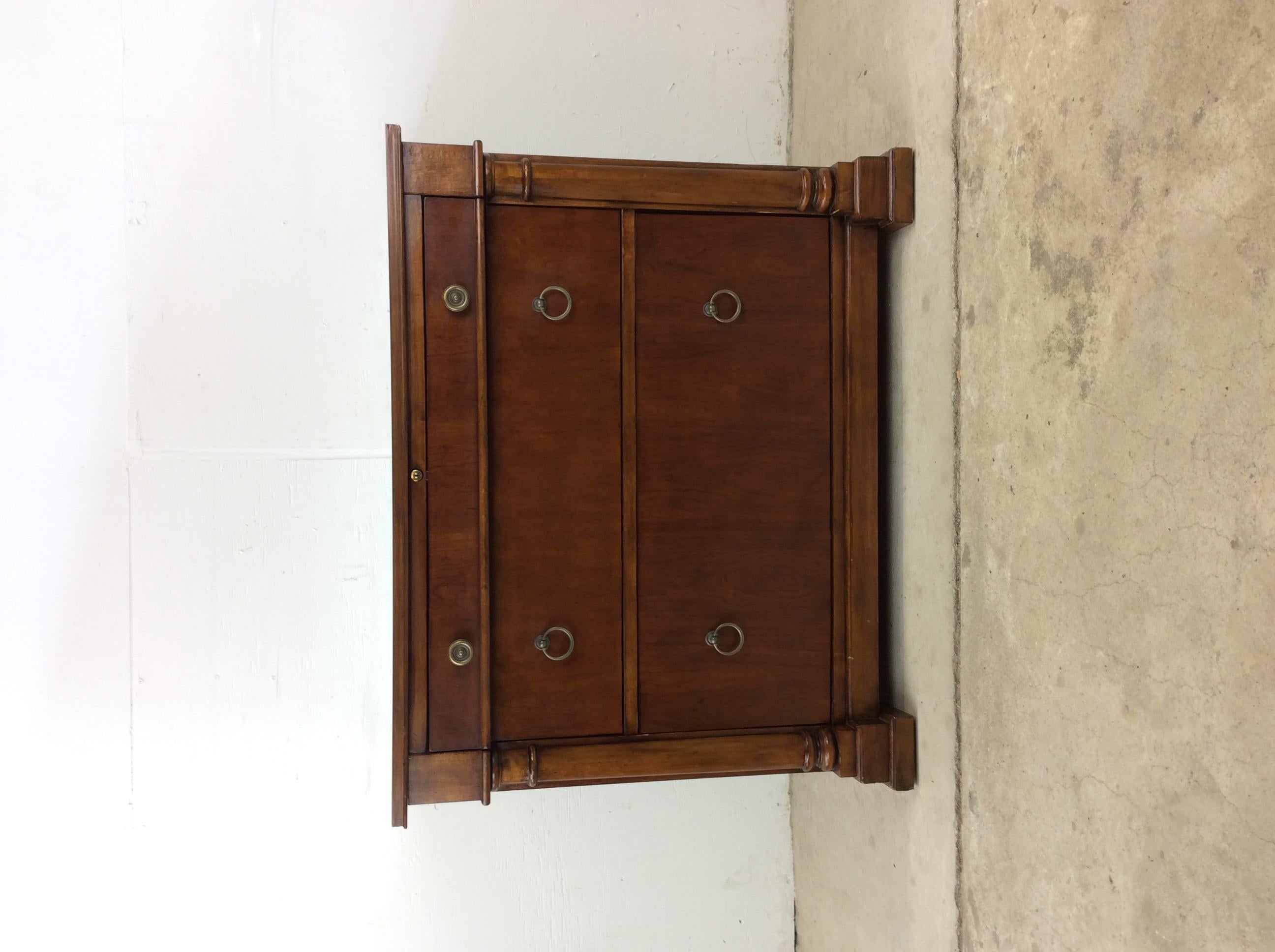 This vintage federalist style chest of drawers features hardwood construction, original cherry finish, brass accented hardware and one locking top drawer.

Dimensions: 37.75w 22.25d 30.5h

Condition: Original finish is in excellent condition.