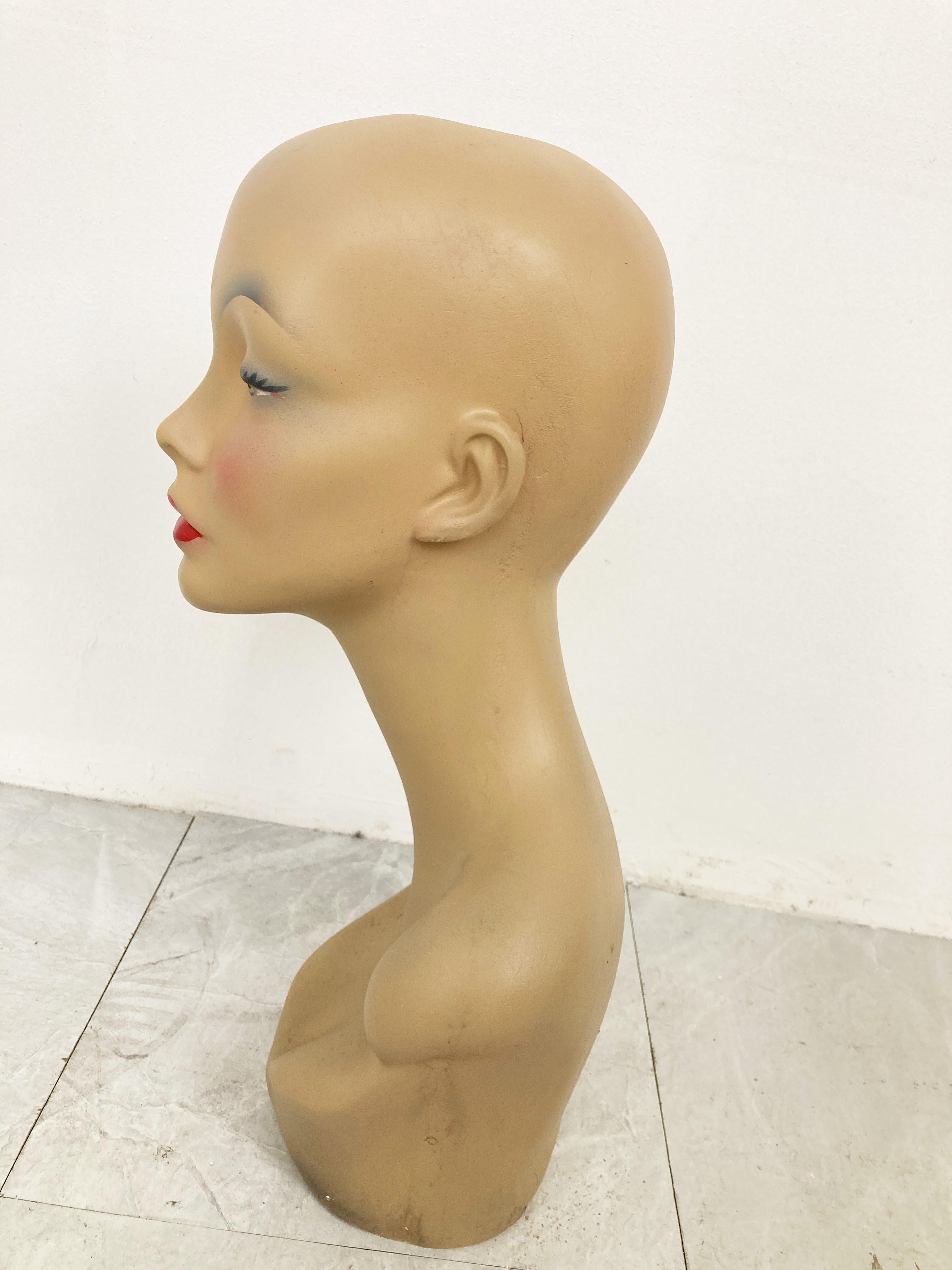 Beautiful female mannequin hat stand made from plaster.

It was used to be displayed at a shopcounter or vitrine.

Comes from a lot acquired from a clothes shop that stopped activities.

Great decorative item to display glasses,