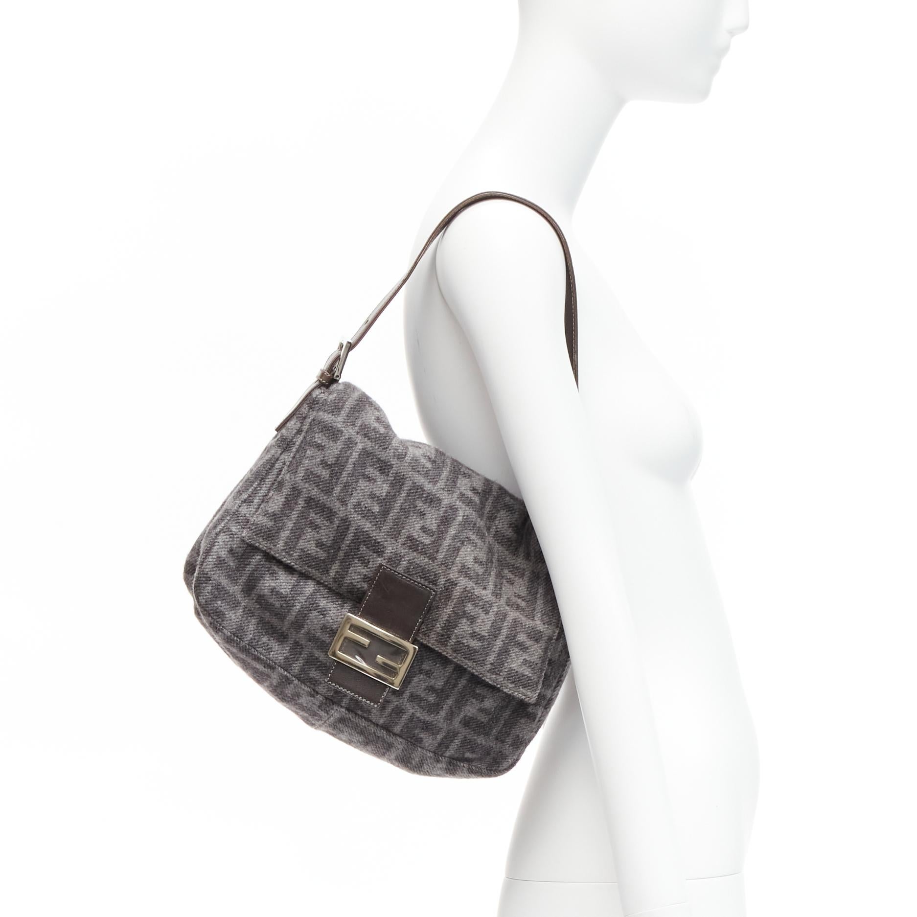 vintage FENDI Baguette FF buckle grey wool logo Zucca monogram underarm flap bag
Reference: TGAS/D00392
Brand: Fendi
Model: Baguette
Material: Wool, Leather, Metal
Color: Grey, Brown
Pattern: Monogram
Closure: Snap Buttons
Lining: Grey Fabric
Extra