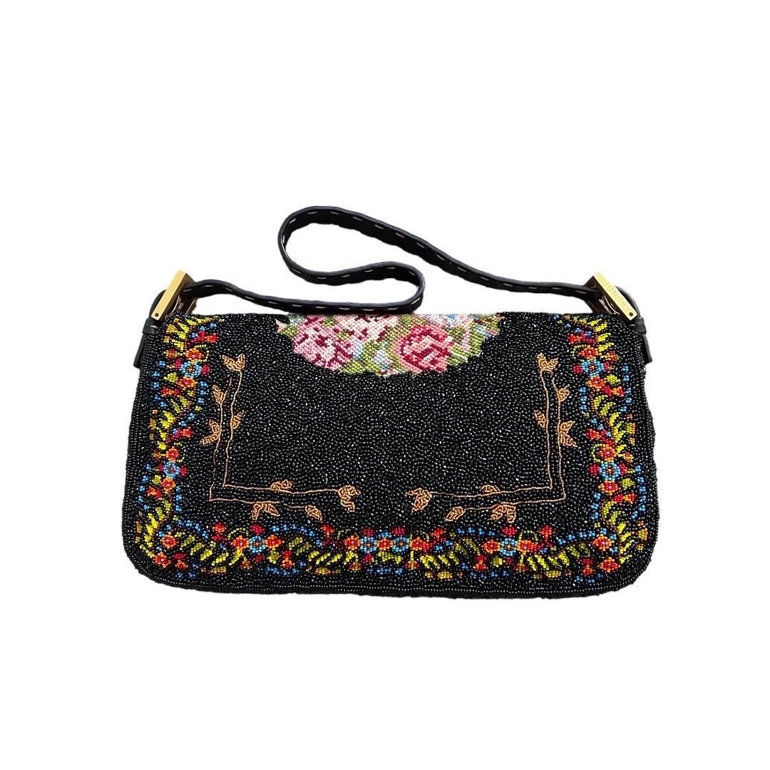 Indulge in opulence with a bag that's a true masterpiece—the Flora Cross Stitch Pattern Baguette. Entirely enveloped in an intricate tapestry of flora-inspired cross-stitch beadwork, this exquisite piece is a testament to artisanal finesse and