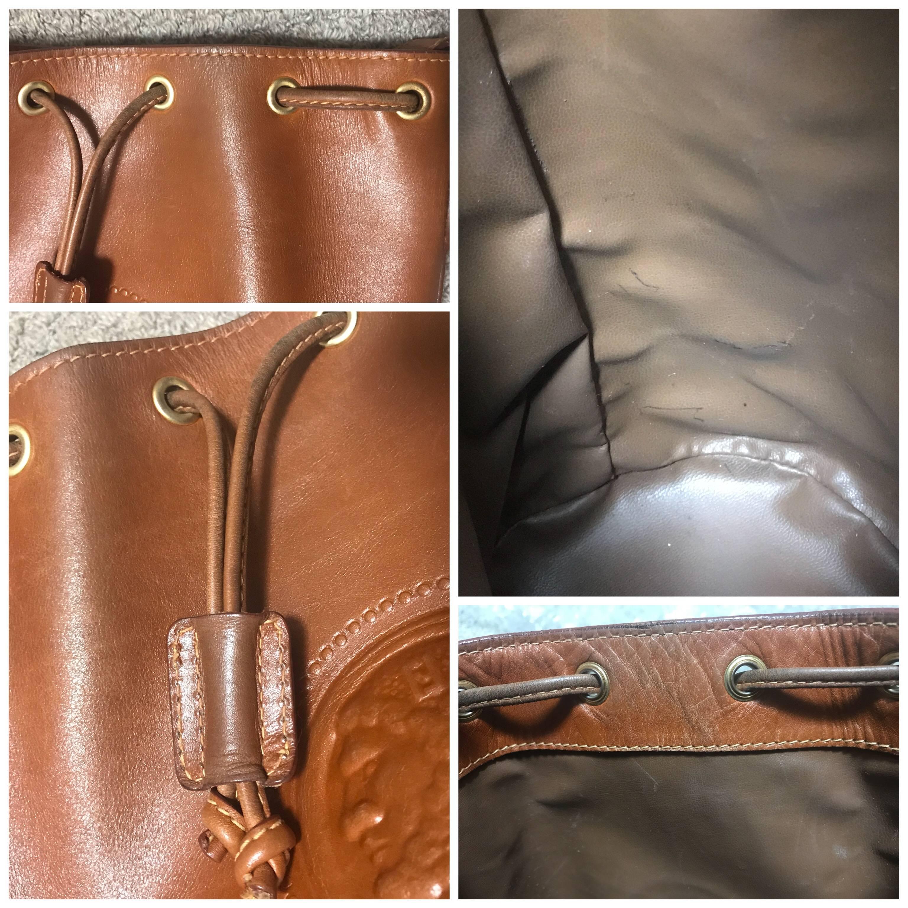 Vintage FENDI brown leather hobo bucket, shoulder bag with drawstring and Janus. 1