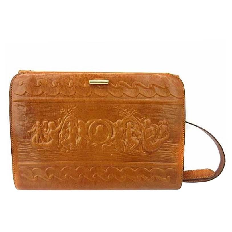 1980s. Vintage FENDI brown leather shoulder bag, large clutch purse with embossed art, Ancient Greece, Mermaid. One-of-a-kind, great masterpiece.
For all FENDI vintage lovers, this unique and rare vintage masterpiece is right for you!
Introducing