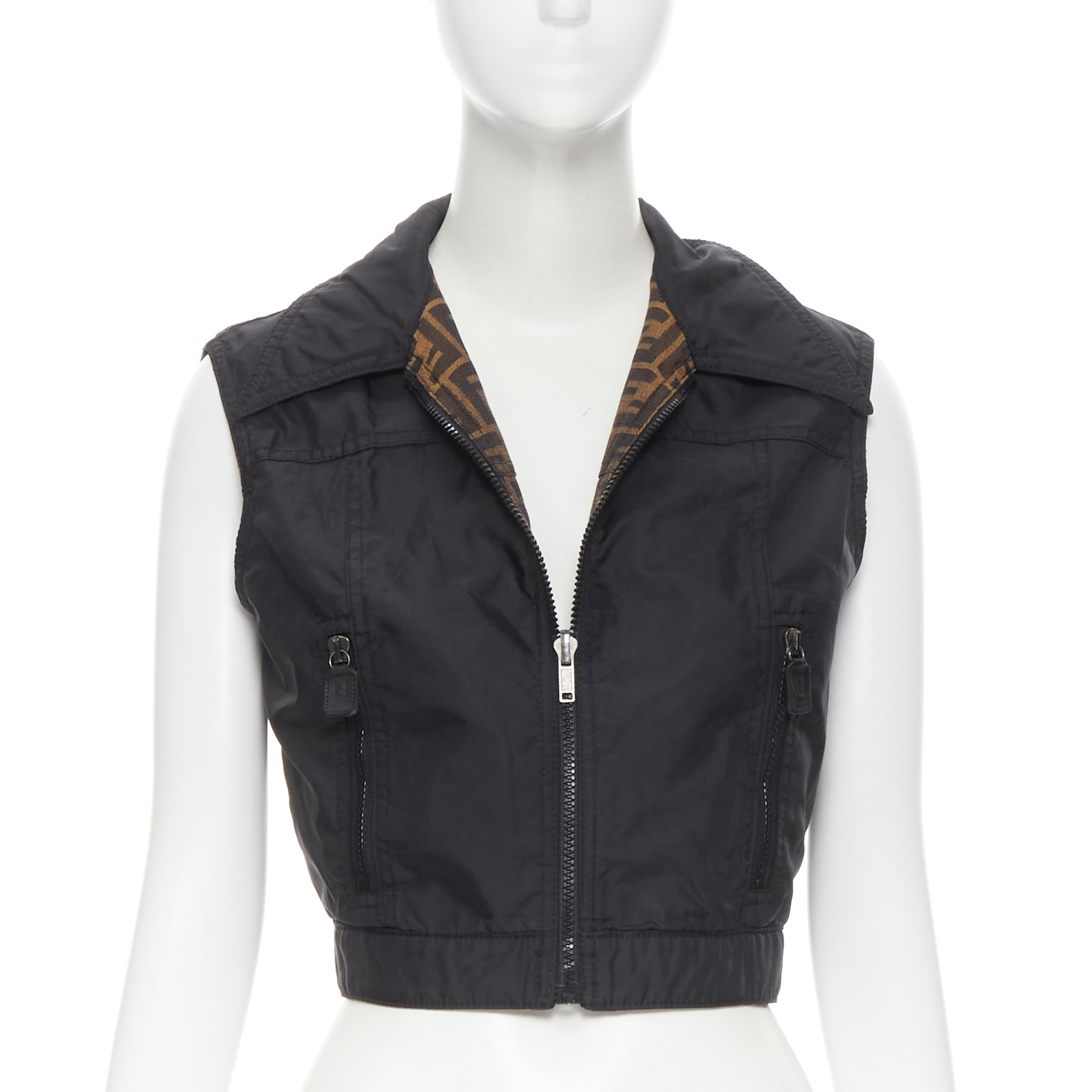 vintage FENDI FF Zucca monogram canvas black nylon reversible vest jacket IT40 S Reference: TGAS/B01367 
Brand: Fendi 
Material: Canvas 
Color: Brown 
Pattern: Solid 
Closure: Zip 
Extra Detail: Reveresible vest. Signature FF Zucca canvas and black