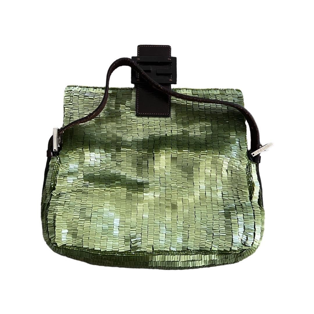 Excellent condition 
Clean interior and exterior
No noticeable sequins missing 
No stains and flaws 
Minor signs of using
The vintage Fendi Green Sequin Baguette Bag is a glamorous and iconic piece that epitomizes the brand's timeless elegance.