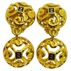 Vintage FENDI logo signed gold designer runway dangle clip on earrings