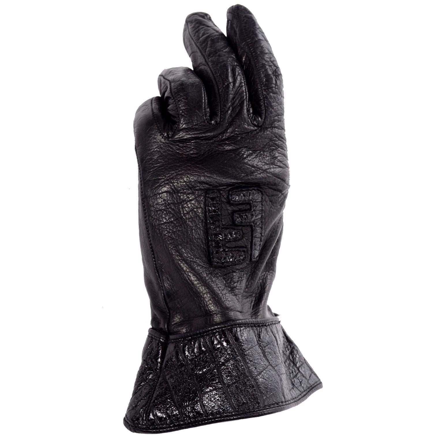 Vintage Black Leather Fendi Monogram crocodile embossed gloves lined in silk. The gloves have a modified gauntlet style and are so soft and comfortable!
Middle FInger to wrist: 7