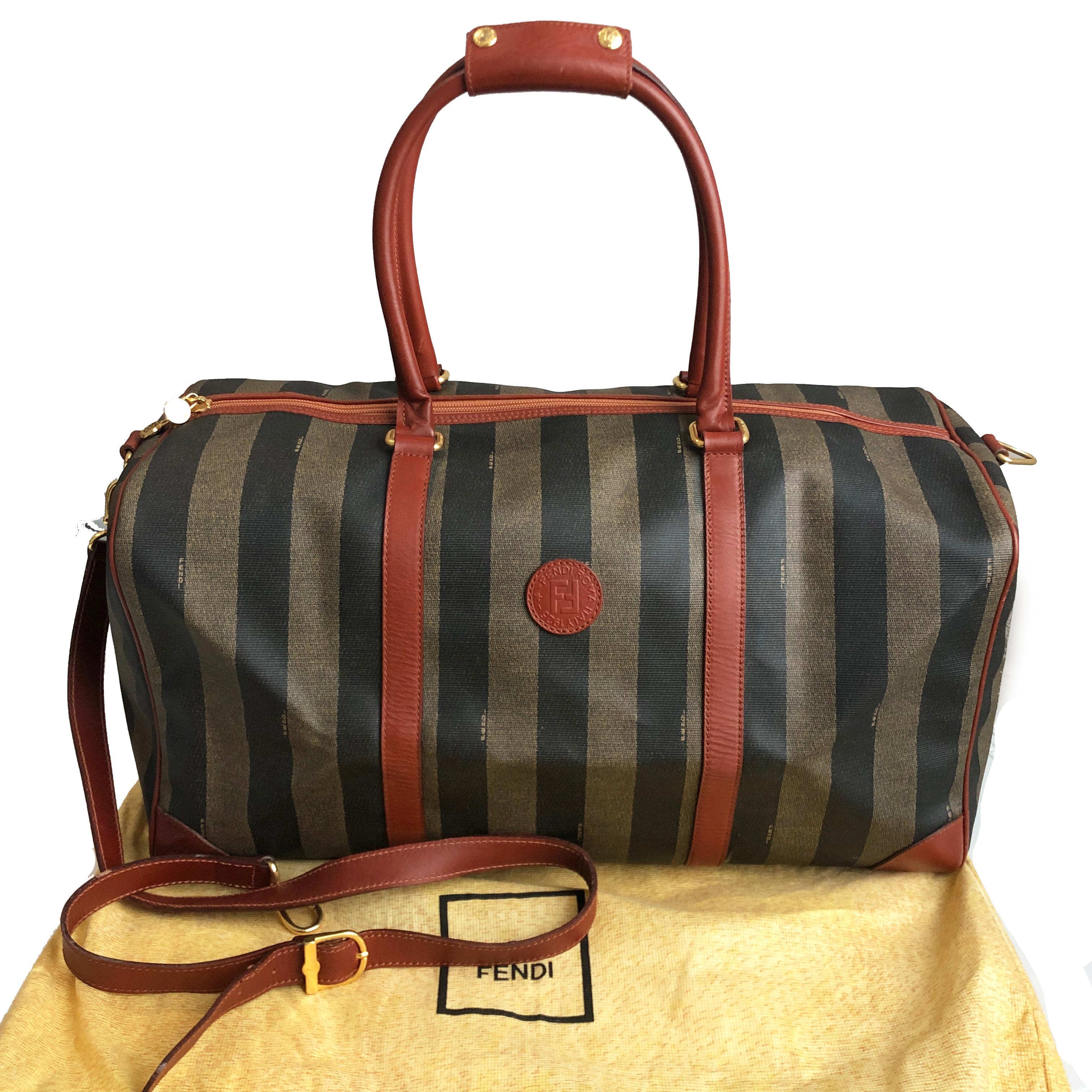Authentic, preowned, vintage 80s FENDI Pequin striped canvas large duffle bag with leather trim & shoulder strap. Zipper fastener/lined in black fabric/one zip pocket/gold metal hardware. Preowned/vintage w/signs of use & prior wear: marks/spots to