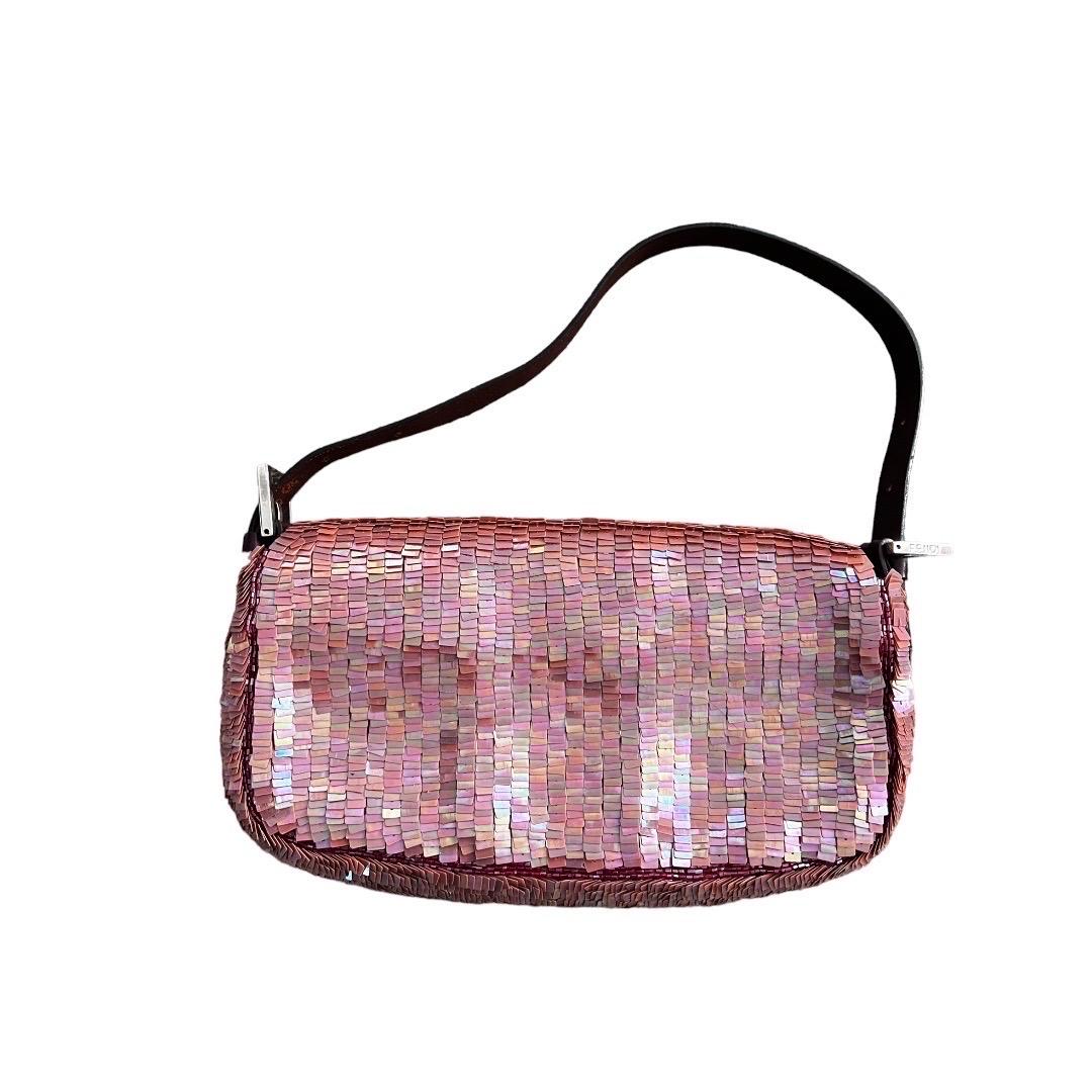 Excellent condition
Clean interior and exterior
No stains or flaws
The vintage Fendi Pink Sequin Baguette Bag is a glamorous and iconic piece that epitomizes the brand's timeless elegance. Crafted with meticulous attention to detail, this exquisite