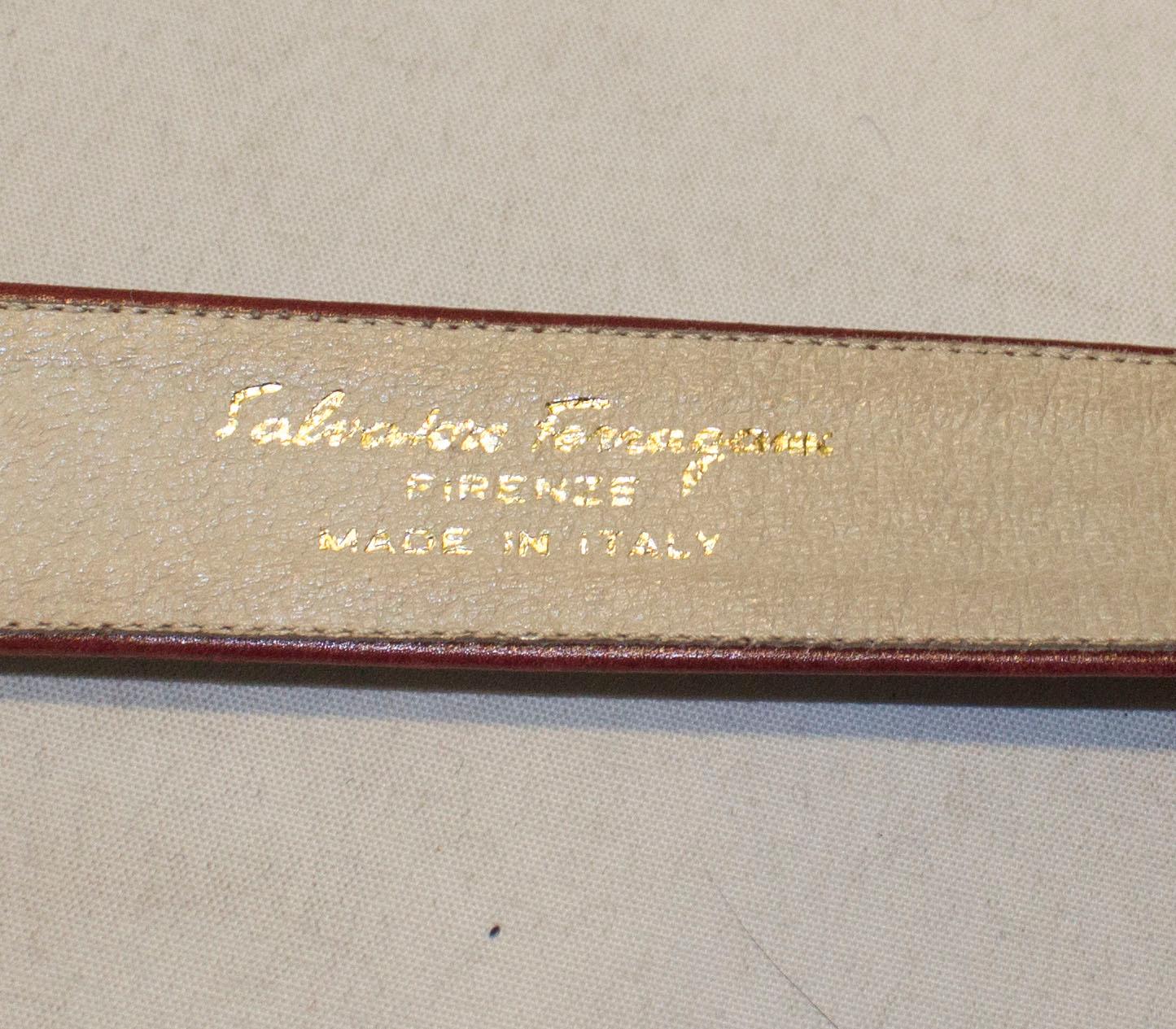 A chic vintage belt by Ferragamo. The belt is in a burgundy leather with attractive gilt buckle. There are three holes but space enough to add more if necessary.
Length 31'' , height 1 1/4''.