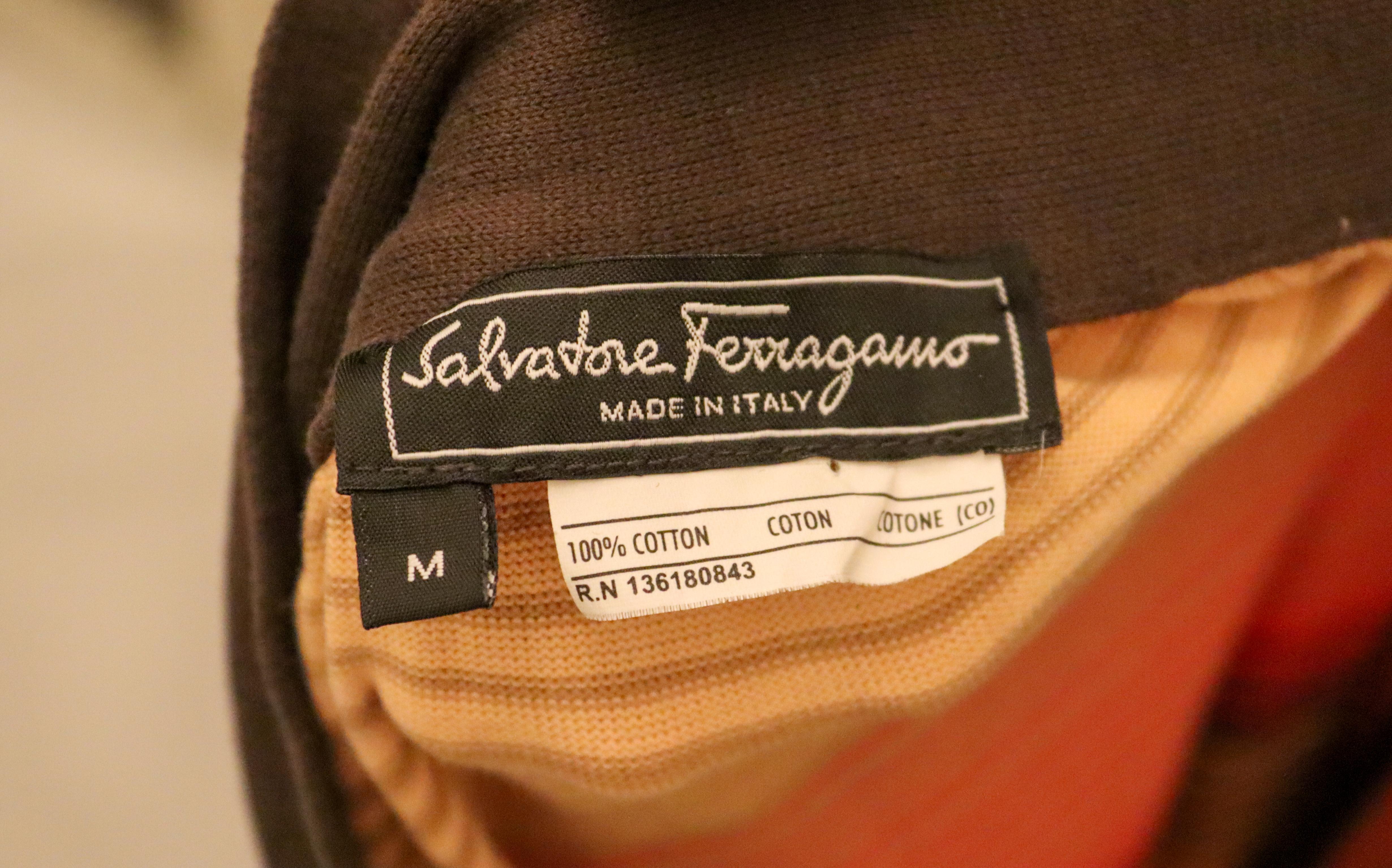 A fun stripe skirt by Ferragamo. The skirt has multi colour horizontal stripes on a vanilla colour background. It has a pocket on either side and a brown waistband that ties at one side . 100 % cotton,  and it is unlined.  Made in Italy, size