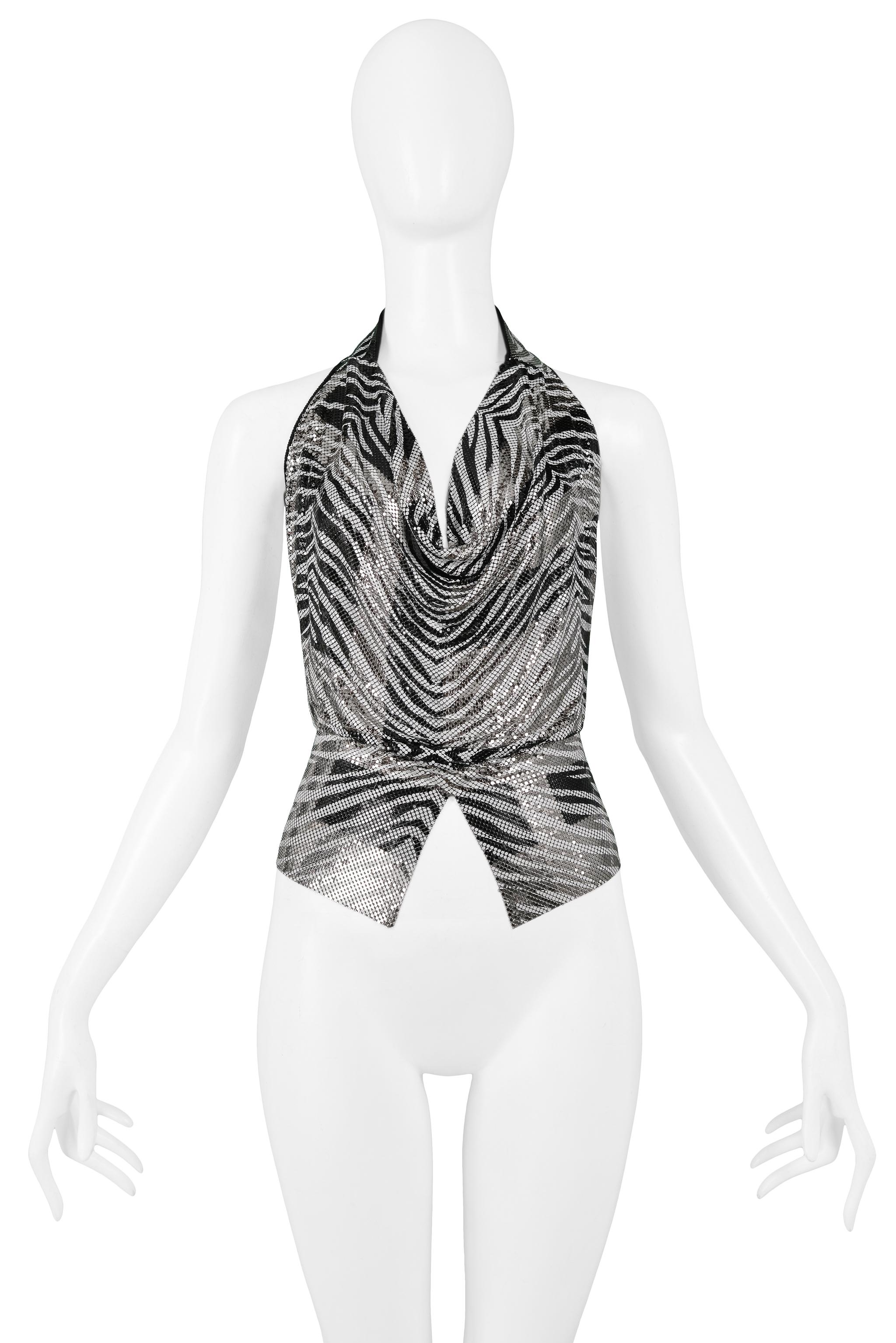 We are excited to offer a vintage Anthony Ferrara handmade black and white zebra print chainmail metal halter top with heavily beaded black and clear rhinestones and labradorite crystal back, leather straps, and diamond front cut out hem. The cowl