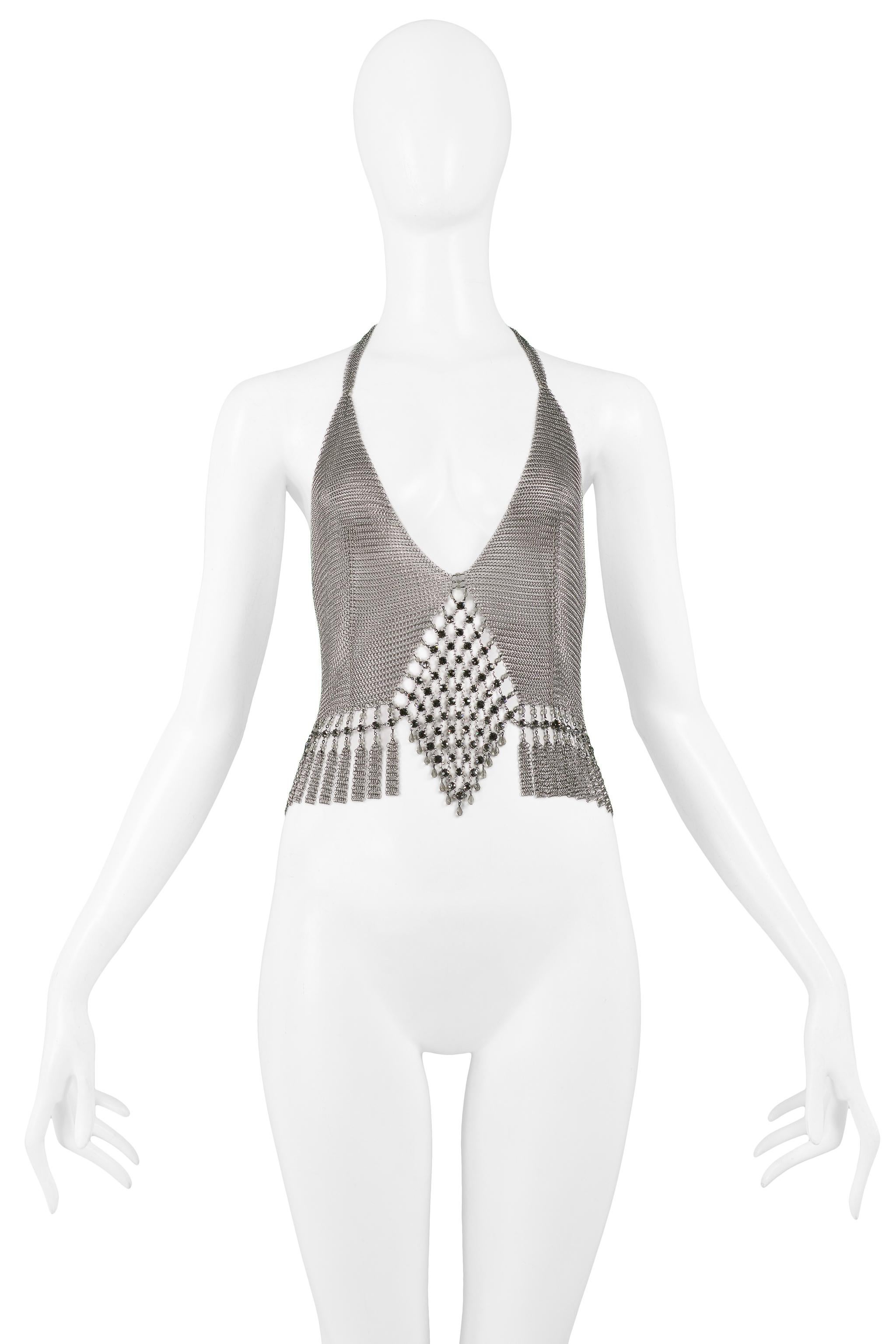 Resurrection Vintage is excited to offer a vintage Anthony Ferrara handmade pewter-tone chainmail metal top with rhinestone and crystal beaded front, intricate cutouts, fringe hem, and open back. The neckline is adjustable and can be worn low or