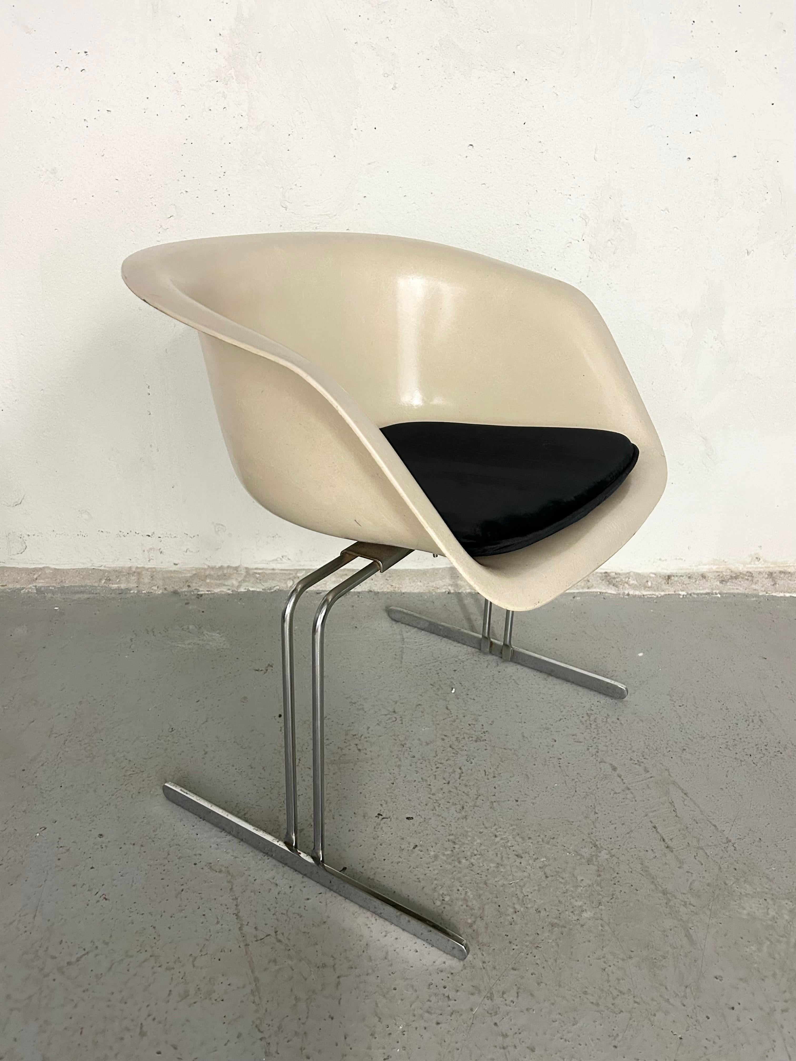 Vintage fiberglass and chrome accent chair by Burke. Black velour cushion is new and not original but included with purchase. Normal vintage wear - a few small marks through fiberglass.

28.5” height
25” arm height
17” seat height
25” width
19” depth