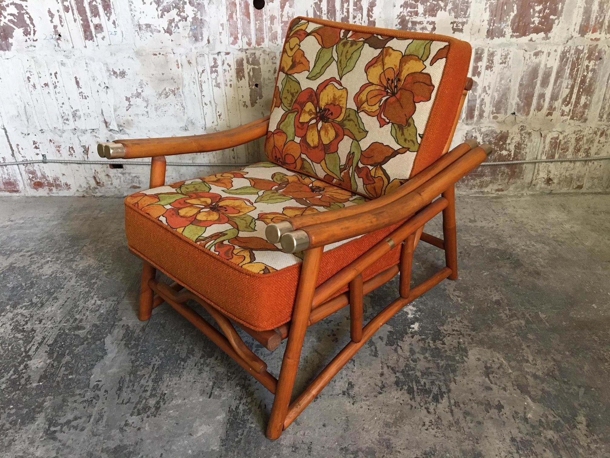 Vintage Ficks Reed bamboo at it's finest. Armchair with floral upholstered cushions and a low, lounge-like stance. Very good condition with only very minor signs of age appropriate wear.  Professional reupholstery available, ask for details.