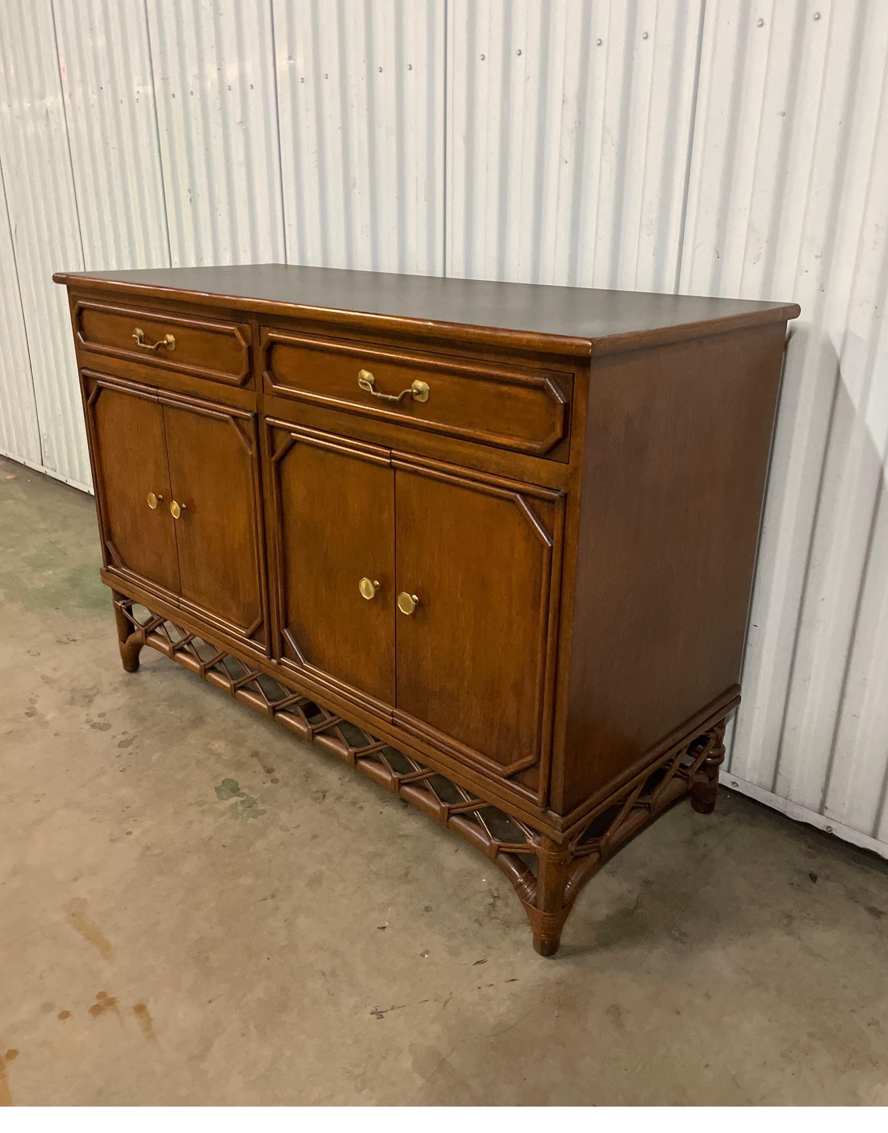 Vintage Ficks reed buffet / sideboard in a dark walnut finish with black laminate top. Two drawers over two double door cabinets provides plenty of storage.