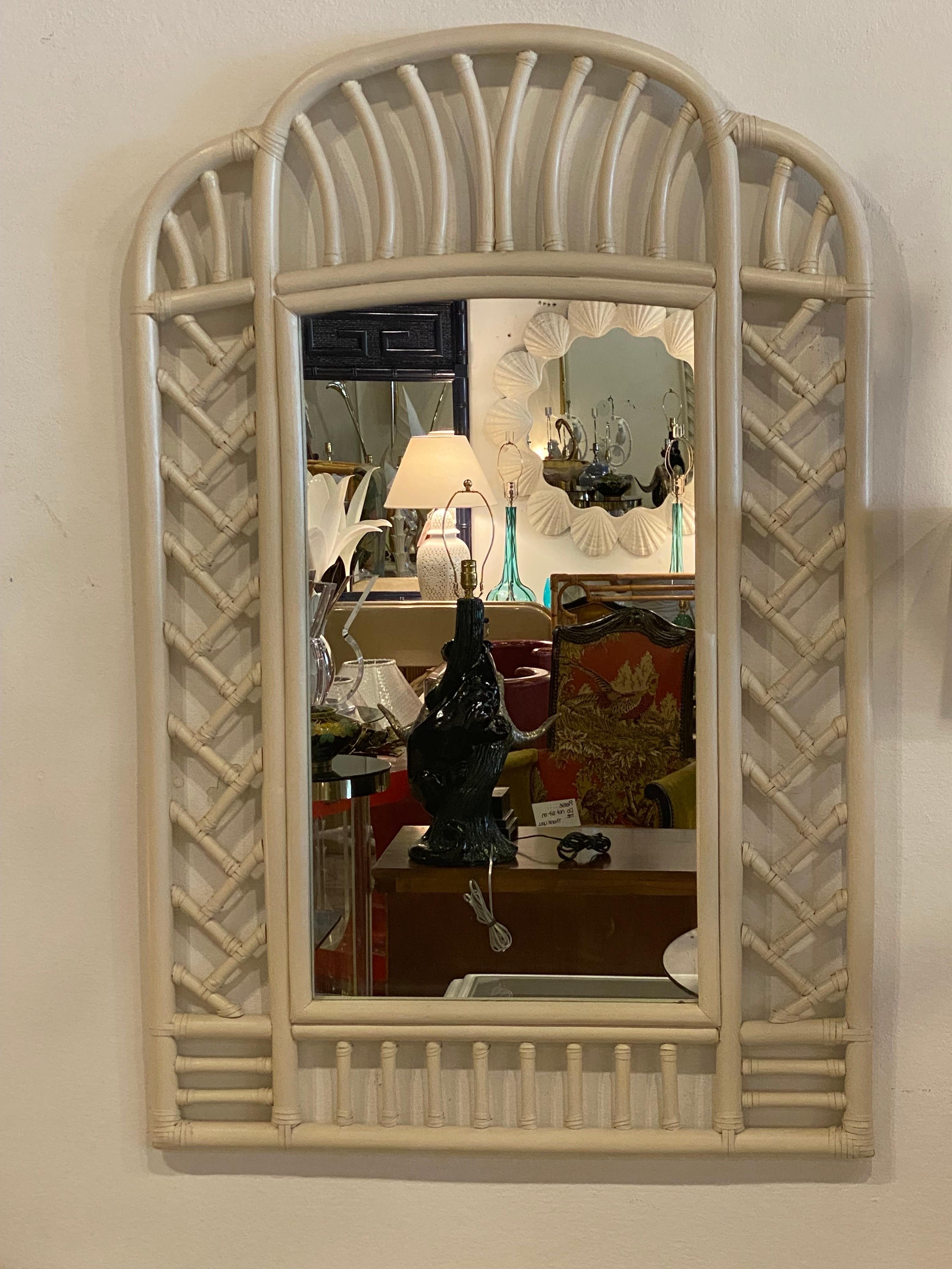Vintage rattan arched chines chippendale Ficks Reed wall mirror. Original cream painted finish may have minor imperfections. This can be lacquered in color of choice for additional charge. Dimensions: 46 H x 30 W x 1.5 D.