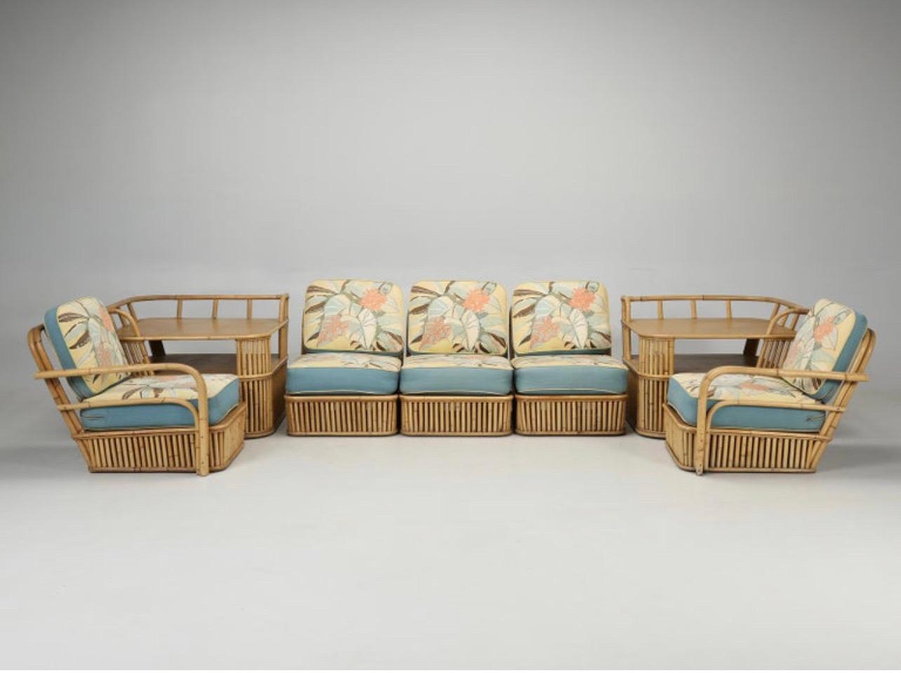 Sensational Ficks Reed midcentury rattan sectional sofa with original cushions. This piece is truly unique and extremely rare. There are five seats and two tables that allow for different seating arrangements. A wonderful midcentury find. Assembled