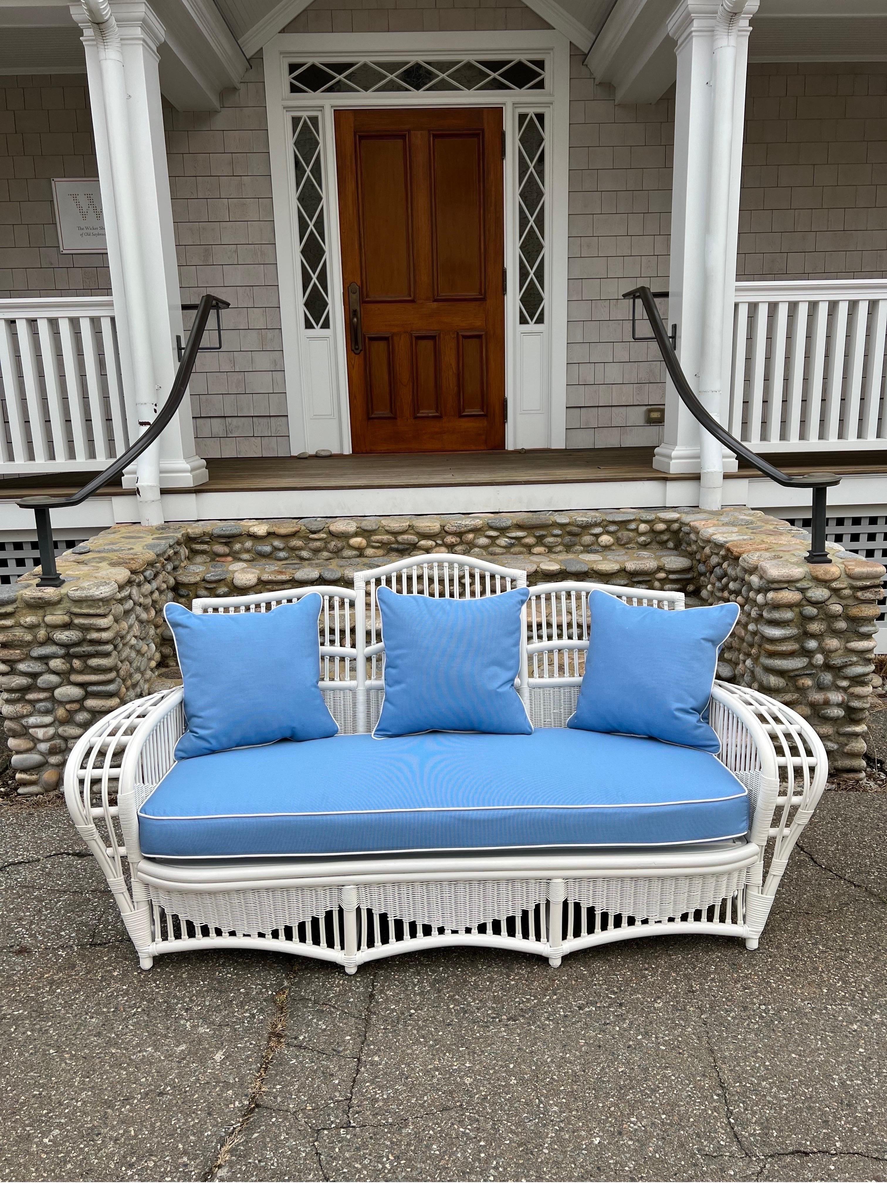 Vintage five piece Ficks Reed patio set freshly painted white with new foam cushions covered in Sunbrella fabric. Tables have half inch glass tops with polished edges. This is a comfortable set with interesting lines.
Measurements:
Sofa: 73