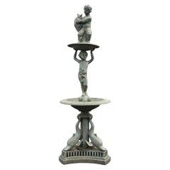 Fontaine de jardin vintage en fonte représentant un chérubin et un dauphin, milieu du XXe siècle