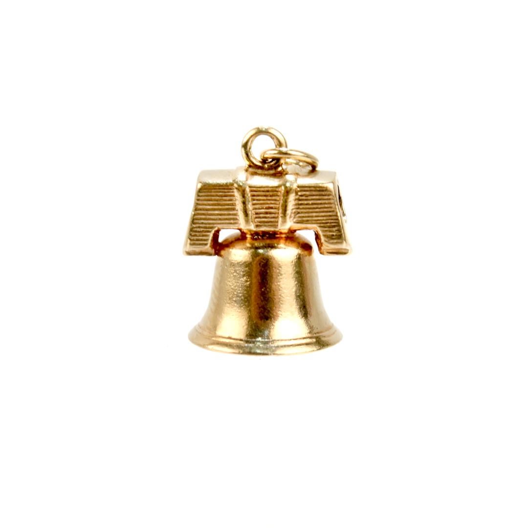 A fine vintage charm for a charm bracelet. 

In 14k yellow gold.

In the form of the Liberty Bell in Philadelphia.

Simply a wonderful charm!

Date:
Mid-20th Century

Overall Condition:
It is in overall good, as-pictured, used estate condition with