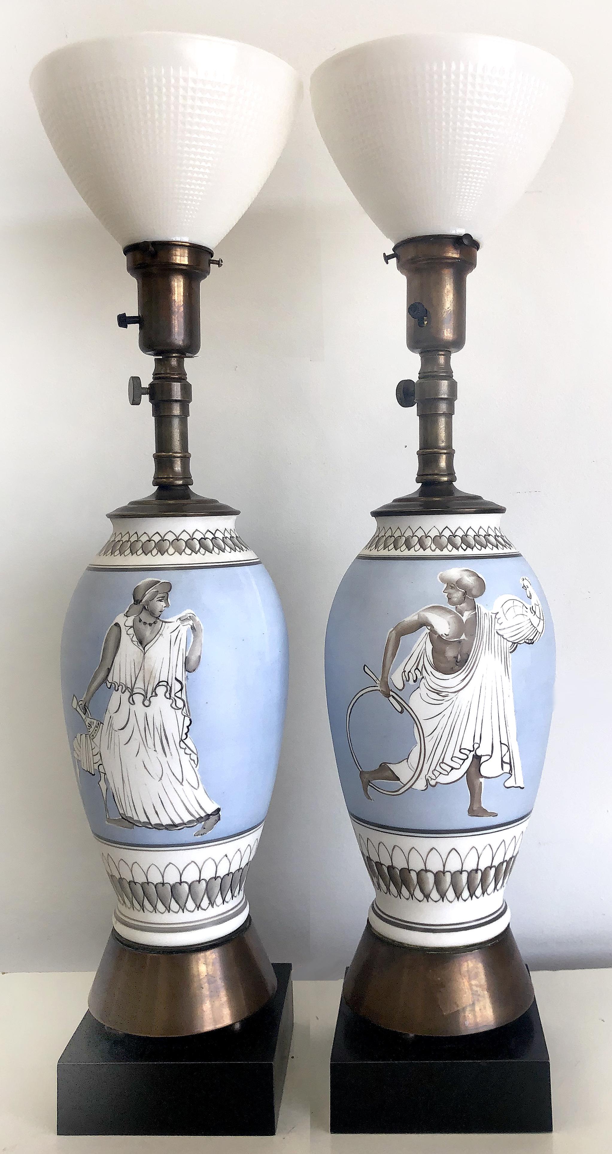 Vintage figural porcelain table lamps


Offered for sale is a vintage pair of vintage elegant hand-painted porcelain lamps.
Each lamp depicts an evocative image of ancient Roman male and female figures. The lamps are supported by brass bases upon